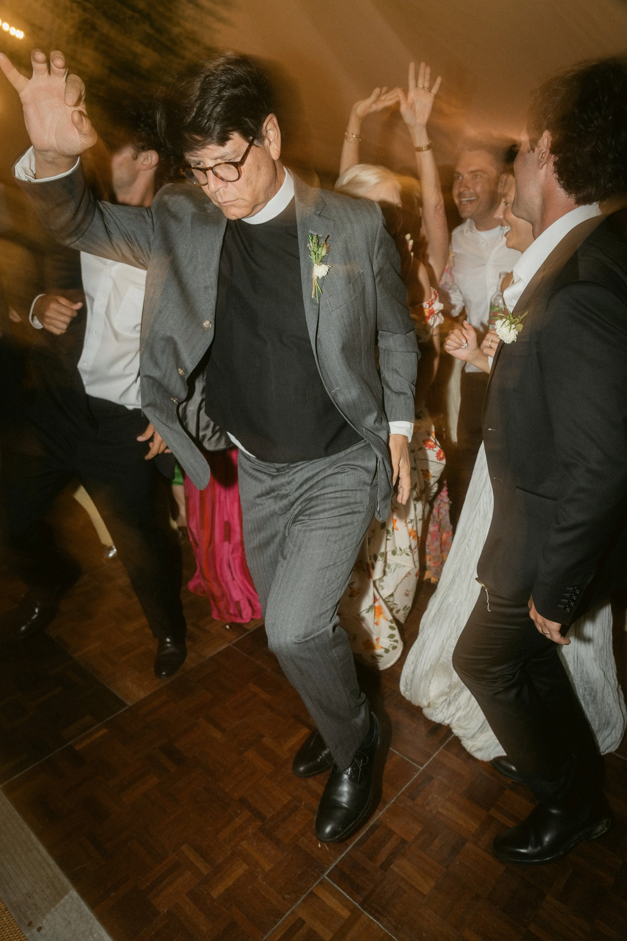 the father of the bride dancing at the evening reception of a roscarrock wedding in cornwall