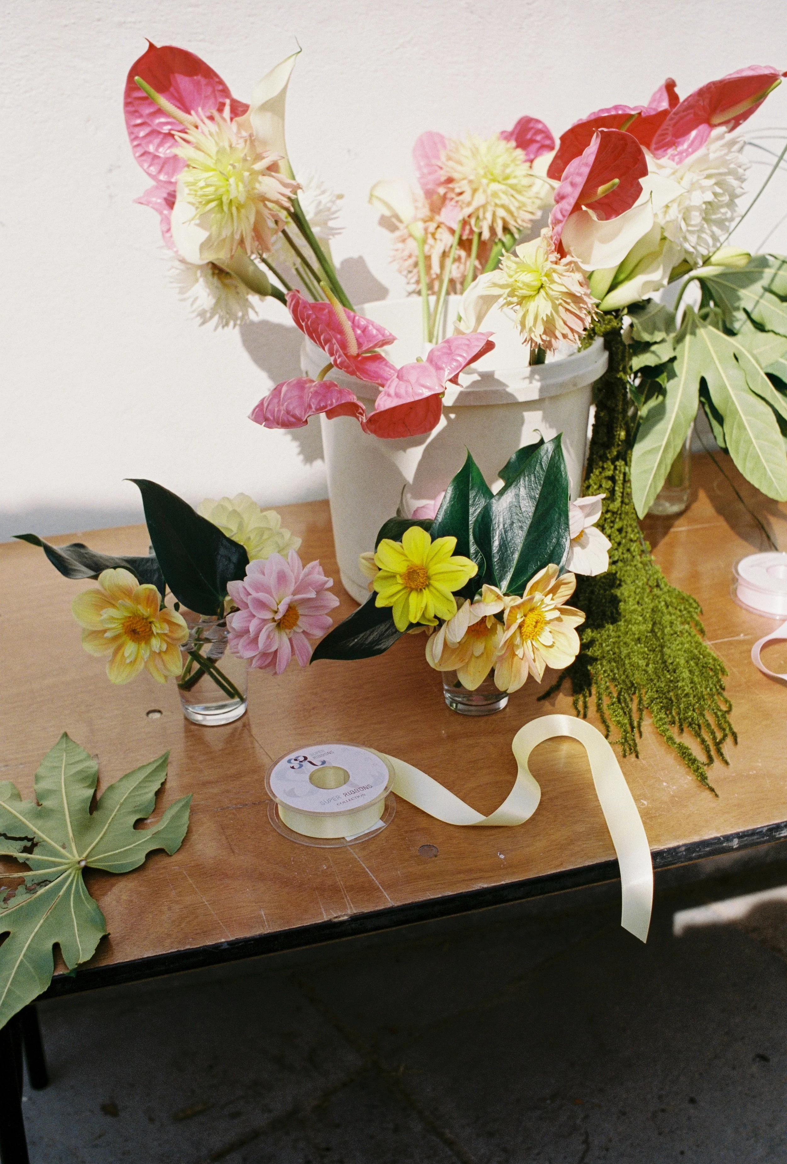 DIY tropical flower wedding bouquets for a cornwall beach wedding