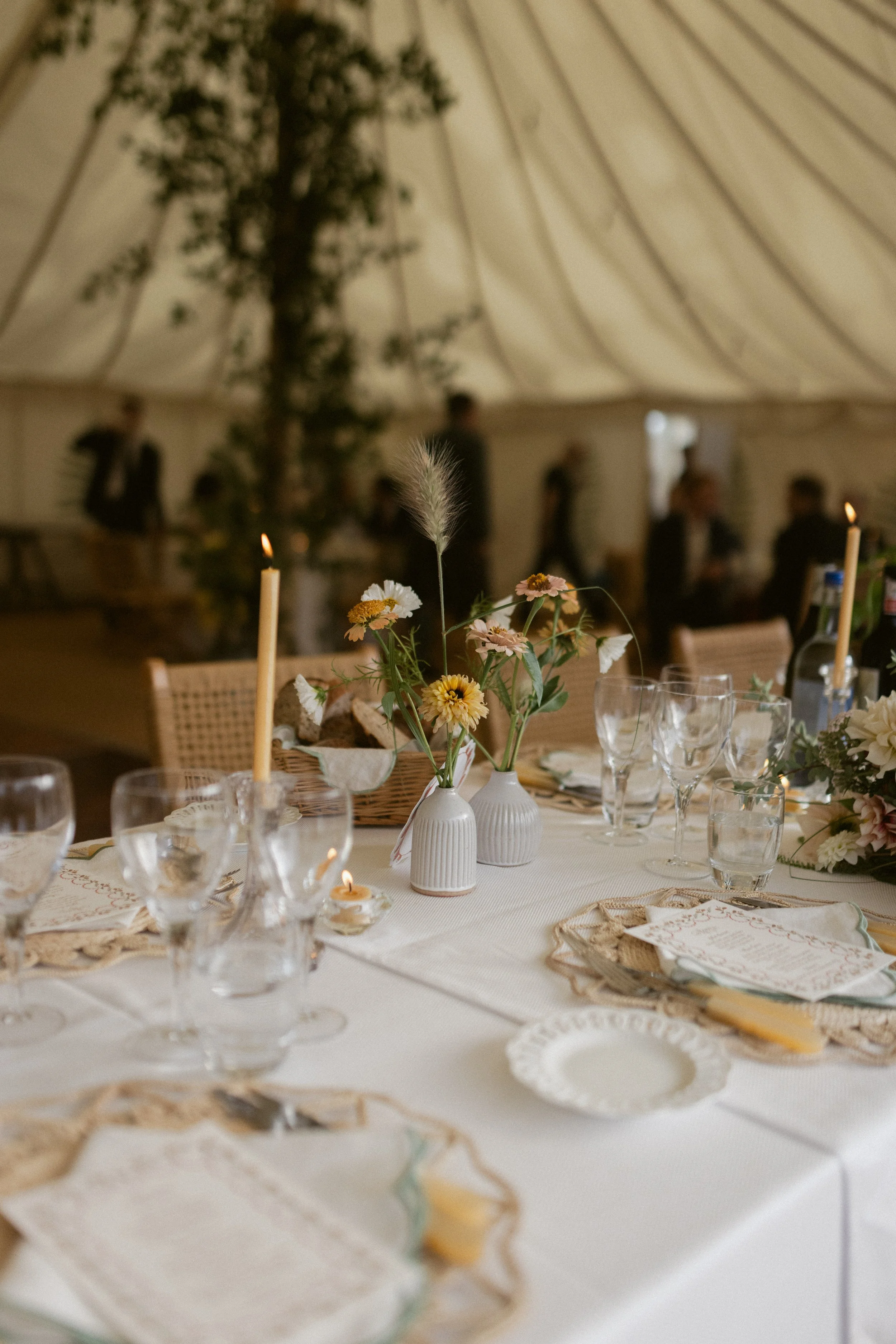 beautiful natural golden table styling for marquee wedding with rattan chairs