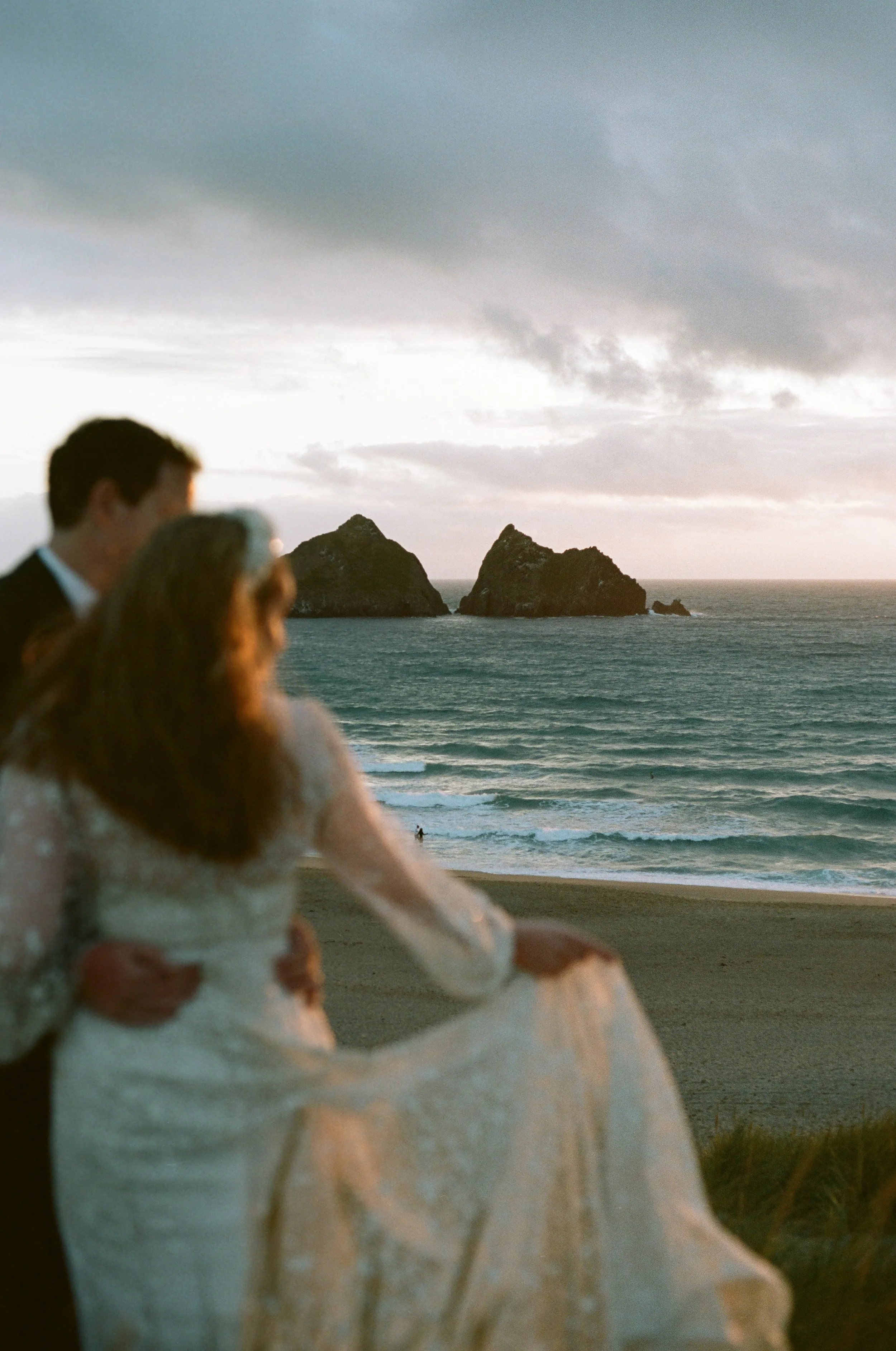 Bluey Hues and rocky islands with bride wearing jesus in piero captured on film by cornwall and devon film photographer featured on Love my dress