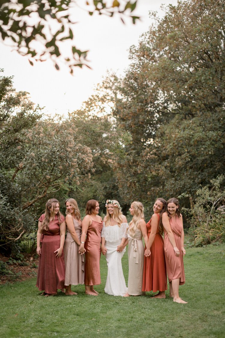 mismatched autumnal bridesmaid dresses inspiration for summer outdoor wedding in Cornwall