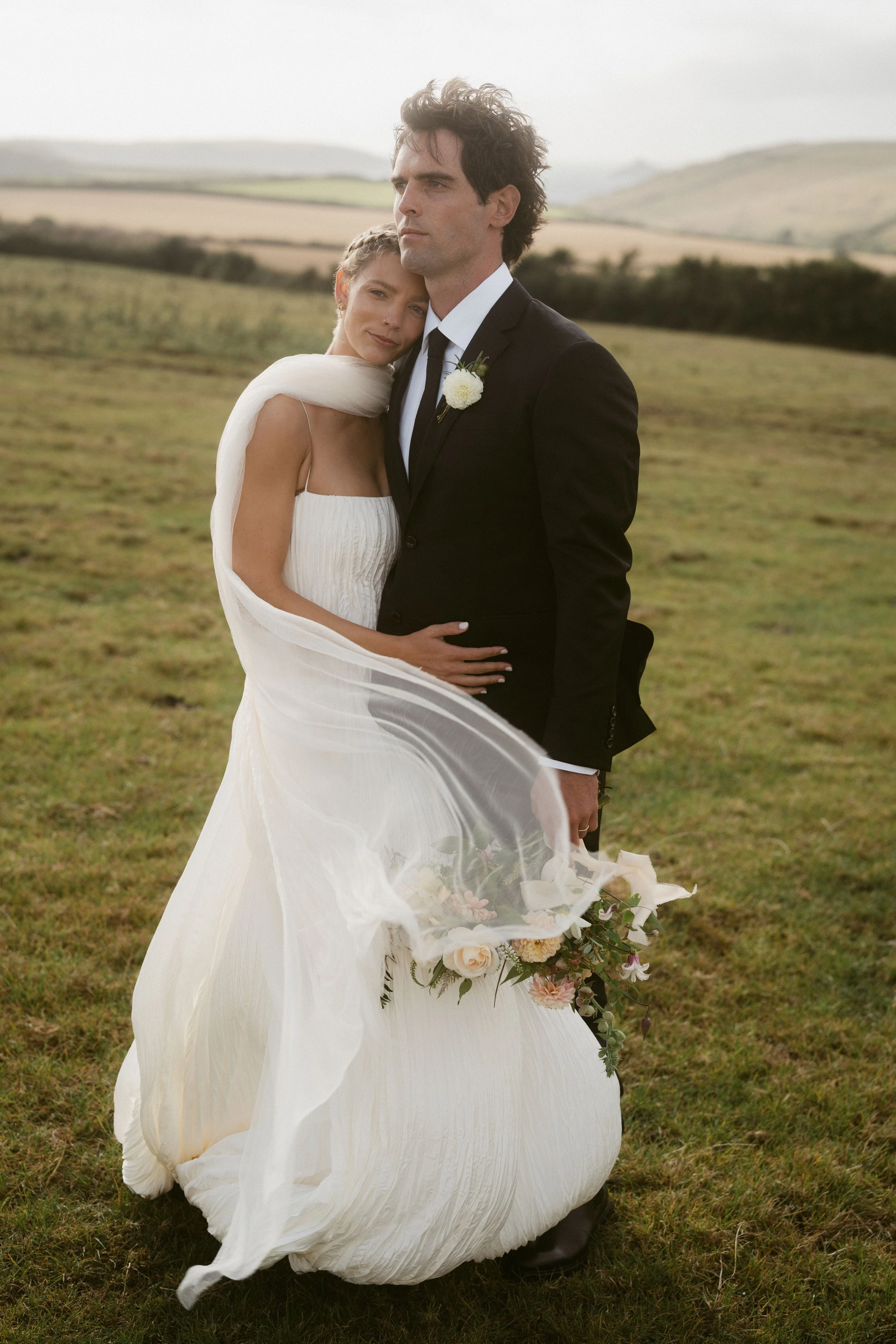 modern romantic summer wedding style with danielle frankel wedding dress and bridal scarf veil