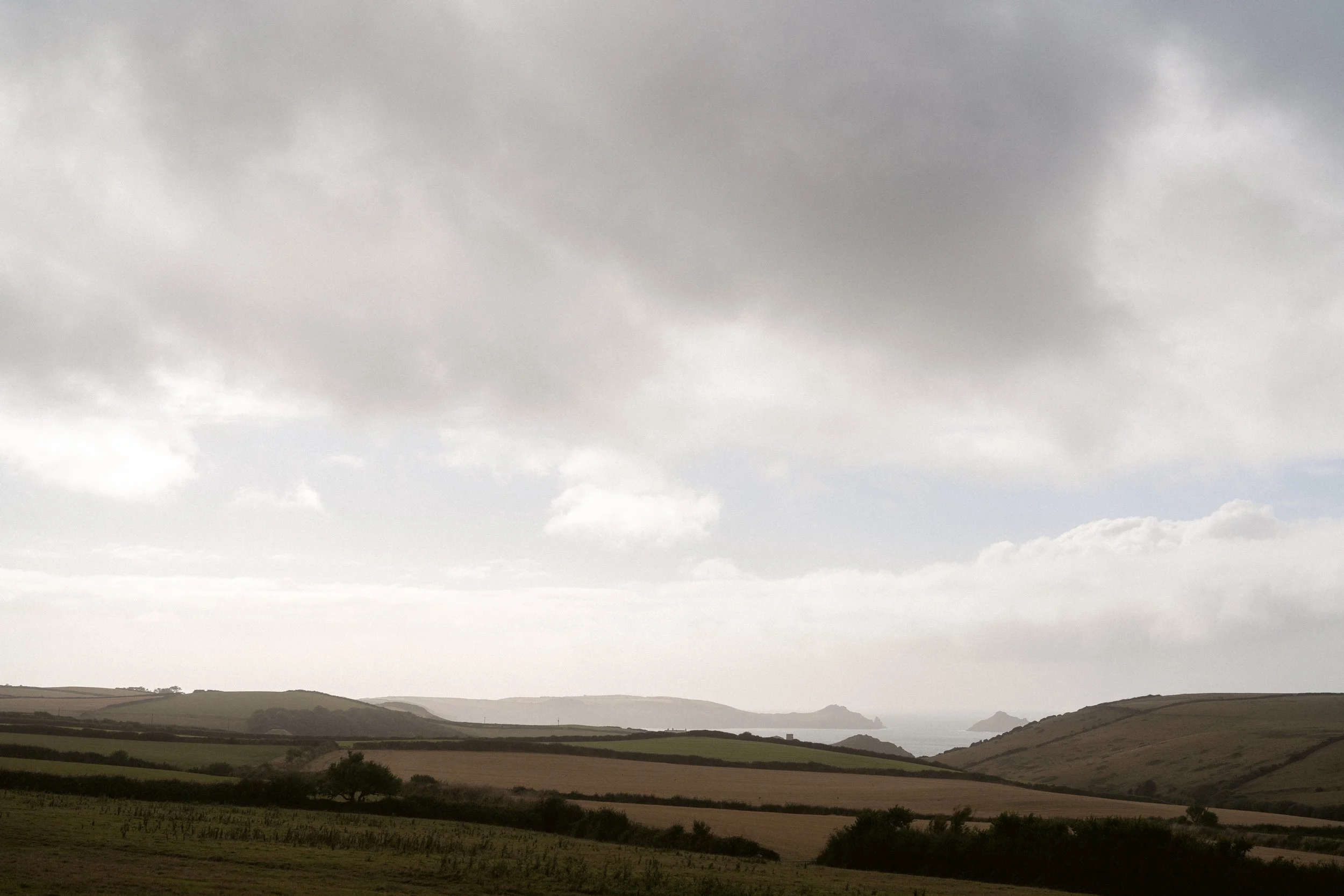 views of the rumps on the cornish north coast on a hazy rainy summers day