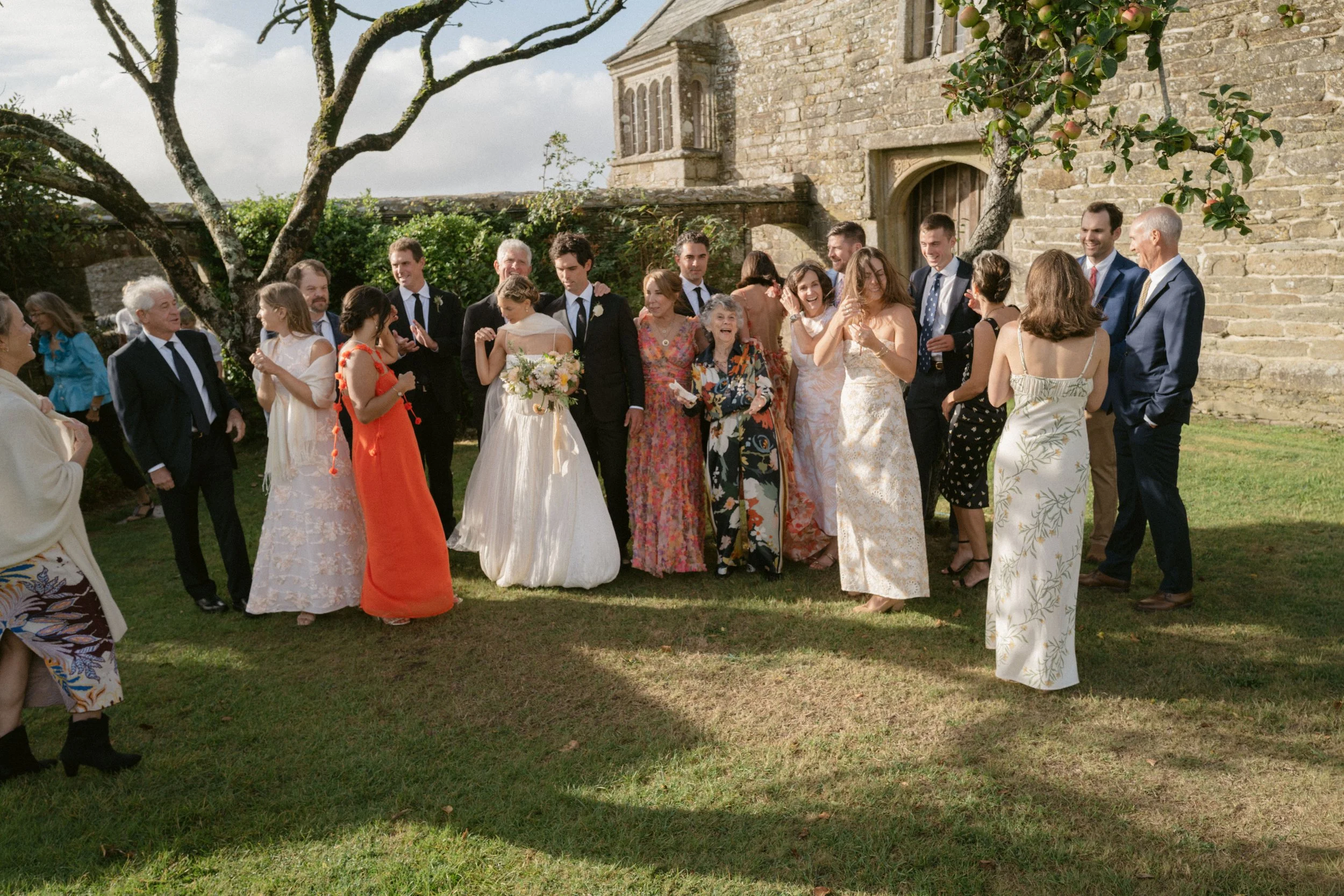 relaxed and candid approach to group photos for a summer wedding in cornwall
