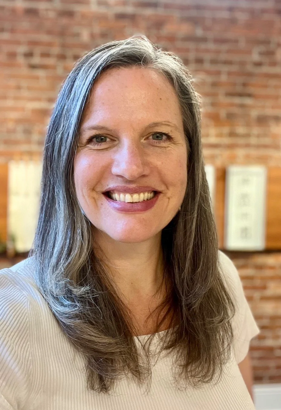 A gray concrete surface with a slightly rough texture and small scattered marks.