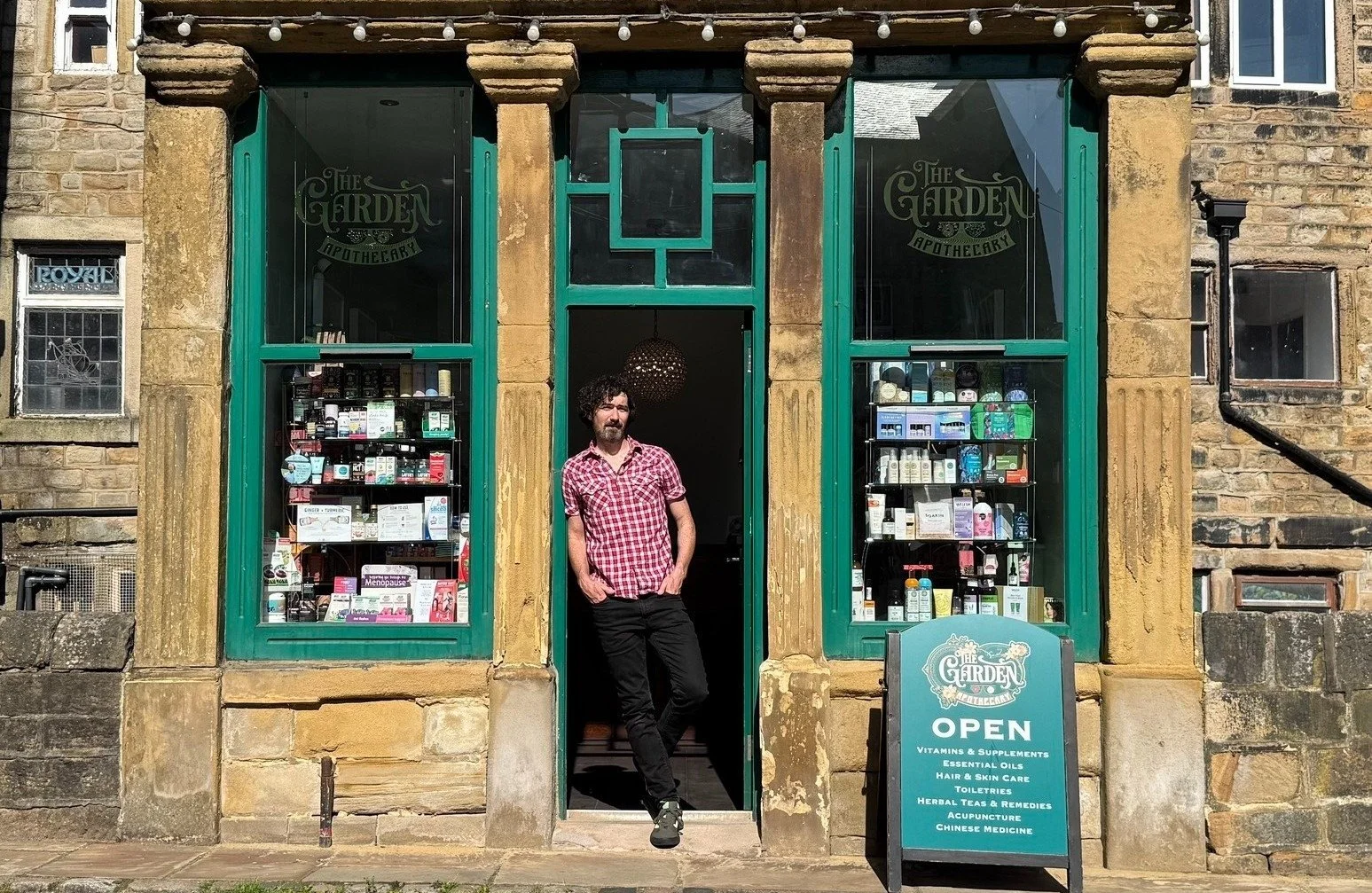 The front of The Garden Apothecary with owner  Ben Haugh  standing at the door