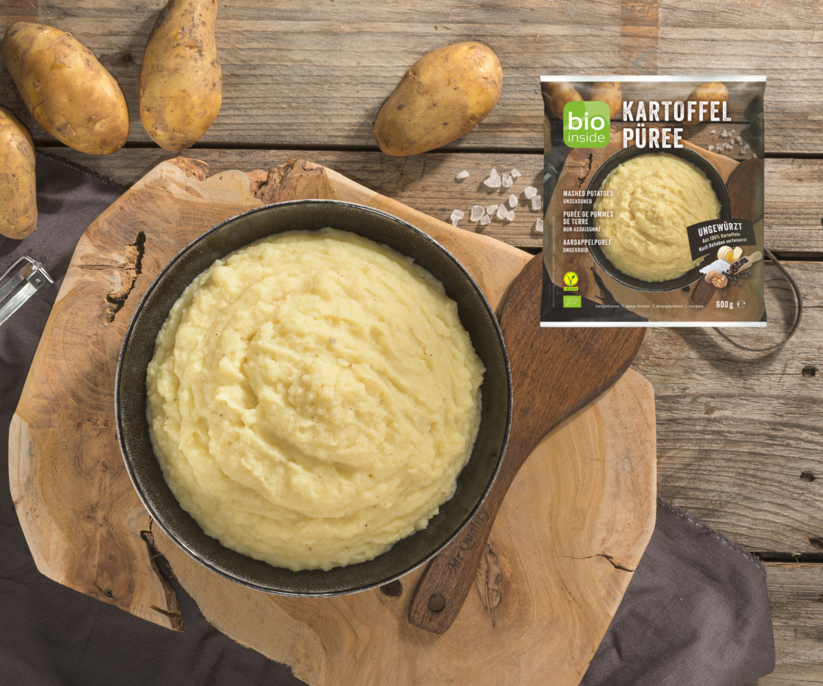 Shot of a pan of mashed potatoes next to a bio inside packshot
