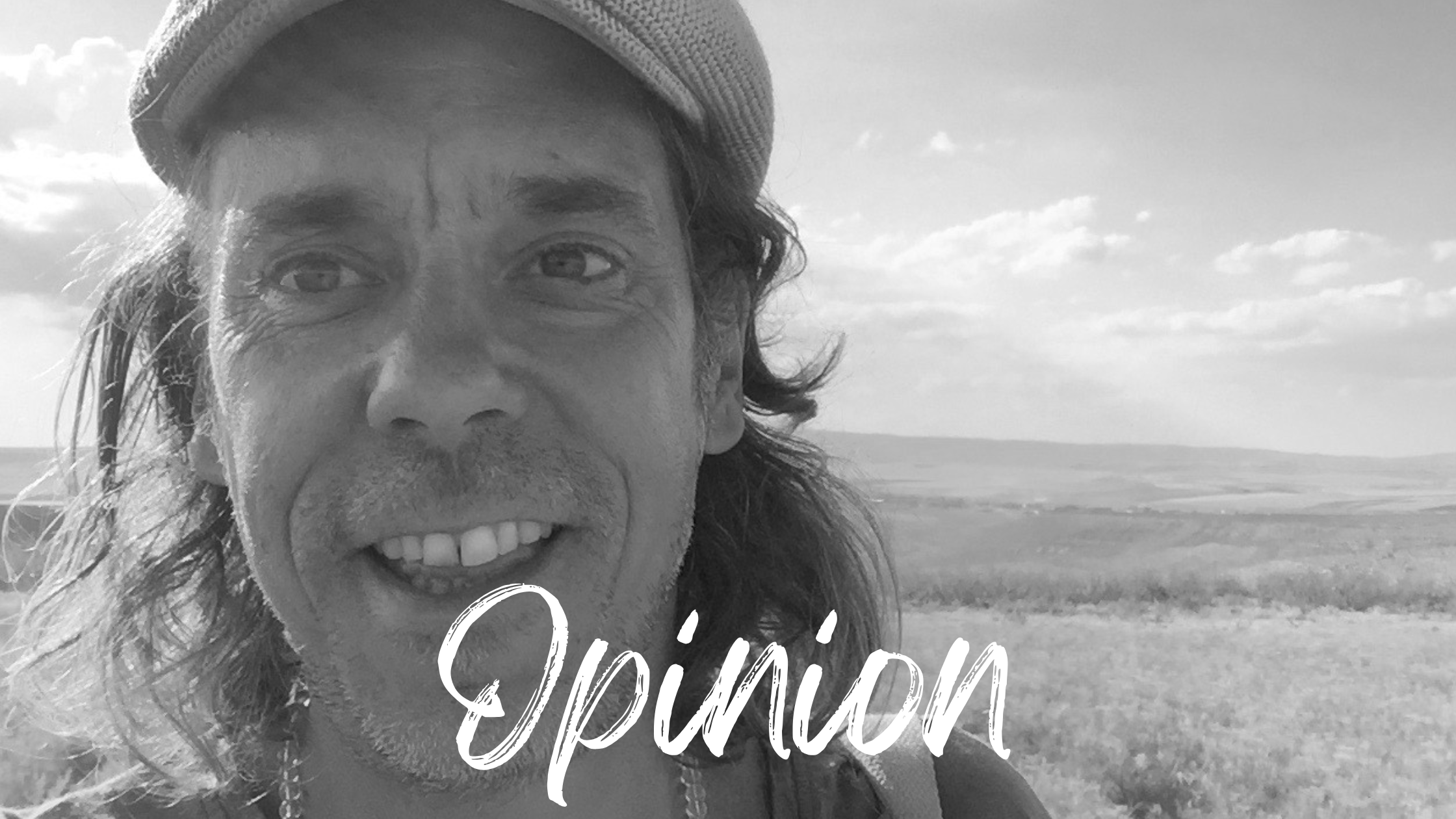 Sebastian Pole against a background of fields.