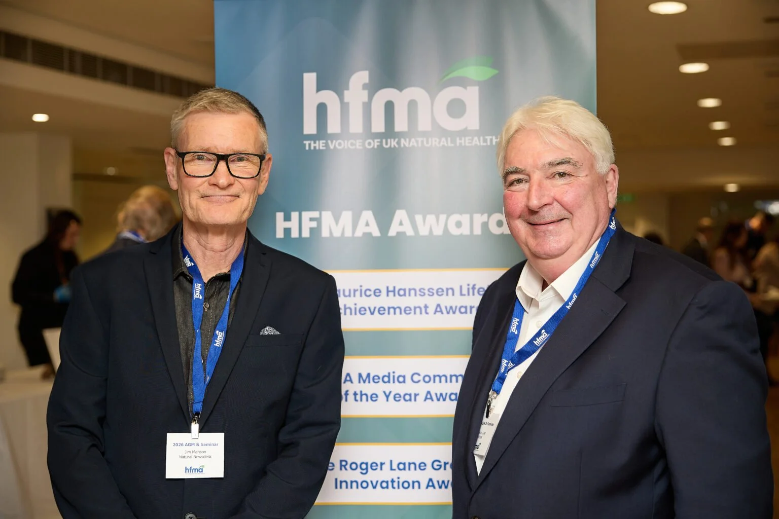 Jim Manson and Martin Last smile infront of an HFMA banner.