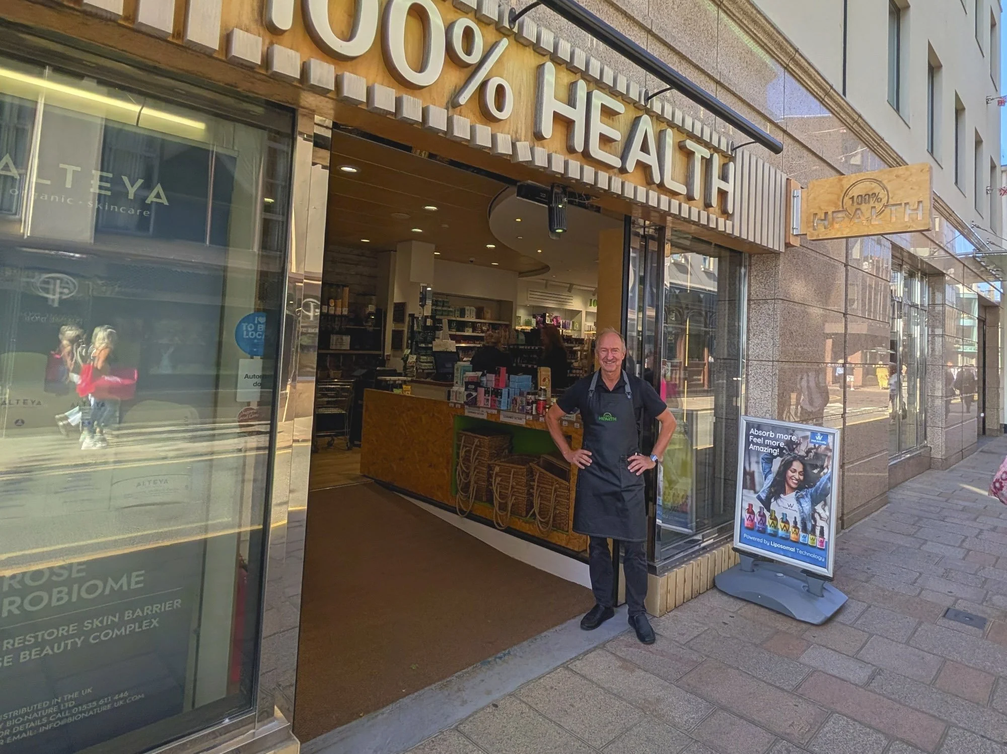 Sean Fuller standing in the doorway of his 100% Health store.