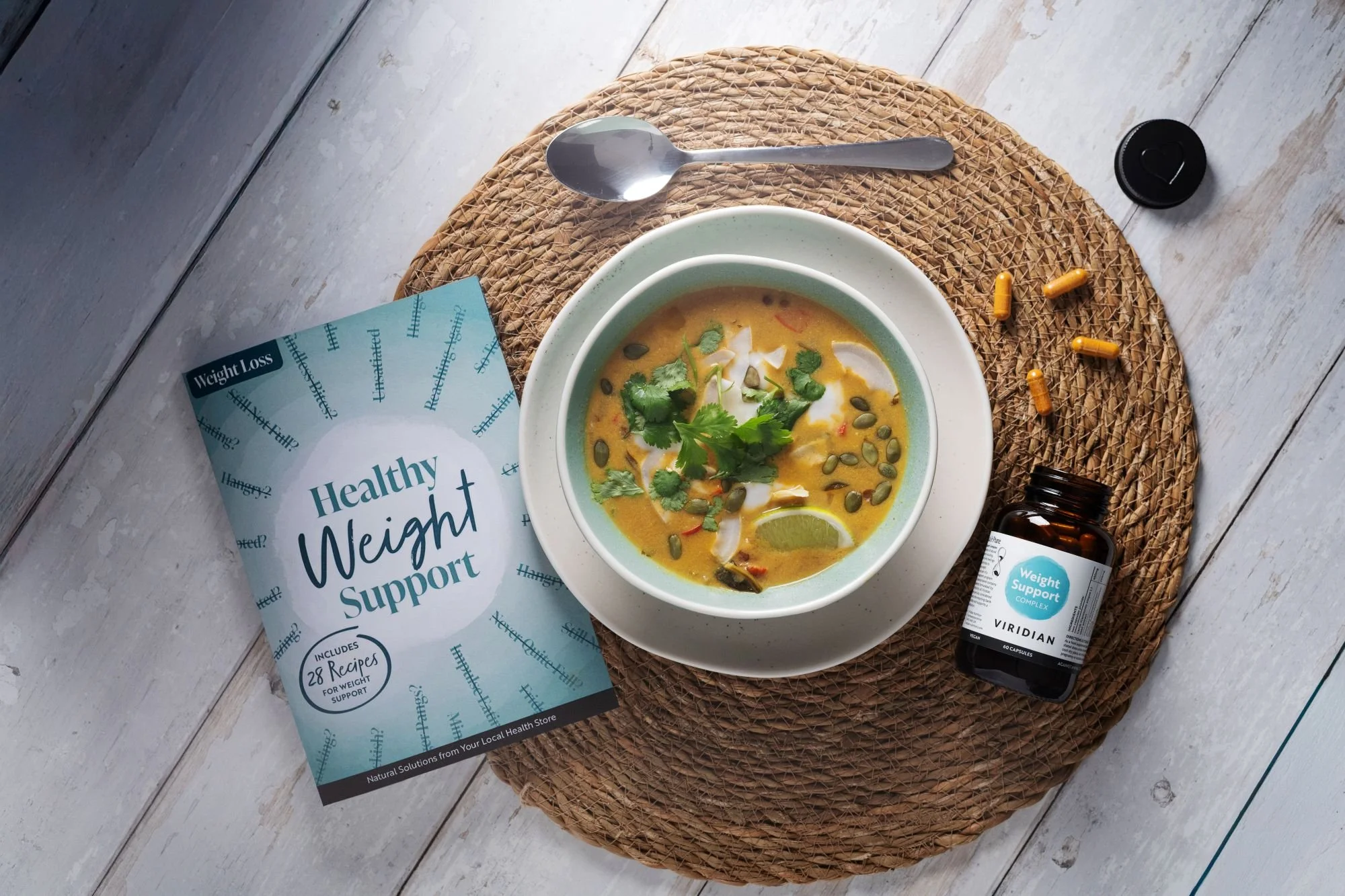A bowl of soup surrounded by Viridian products