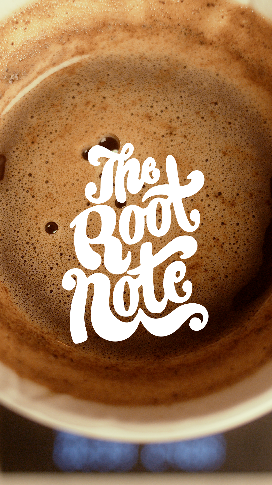 A close-up of a cup of bubbling hot coffee with the words 'The Boot N' Hole' written in white stylized text overlaying the coffee.