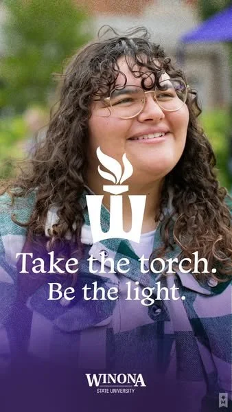 A smiling woman with curly hair, glasses, and a purple jacket outdoors. Overlaid text reads: "Take the torch. Be the light." and includes the WINONA State University logo.