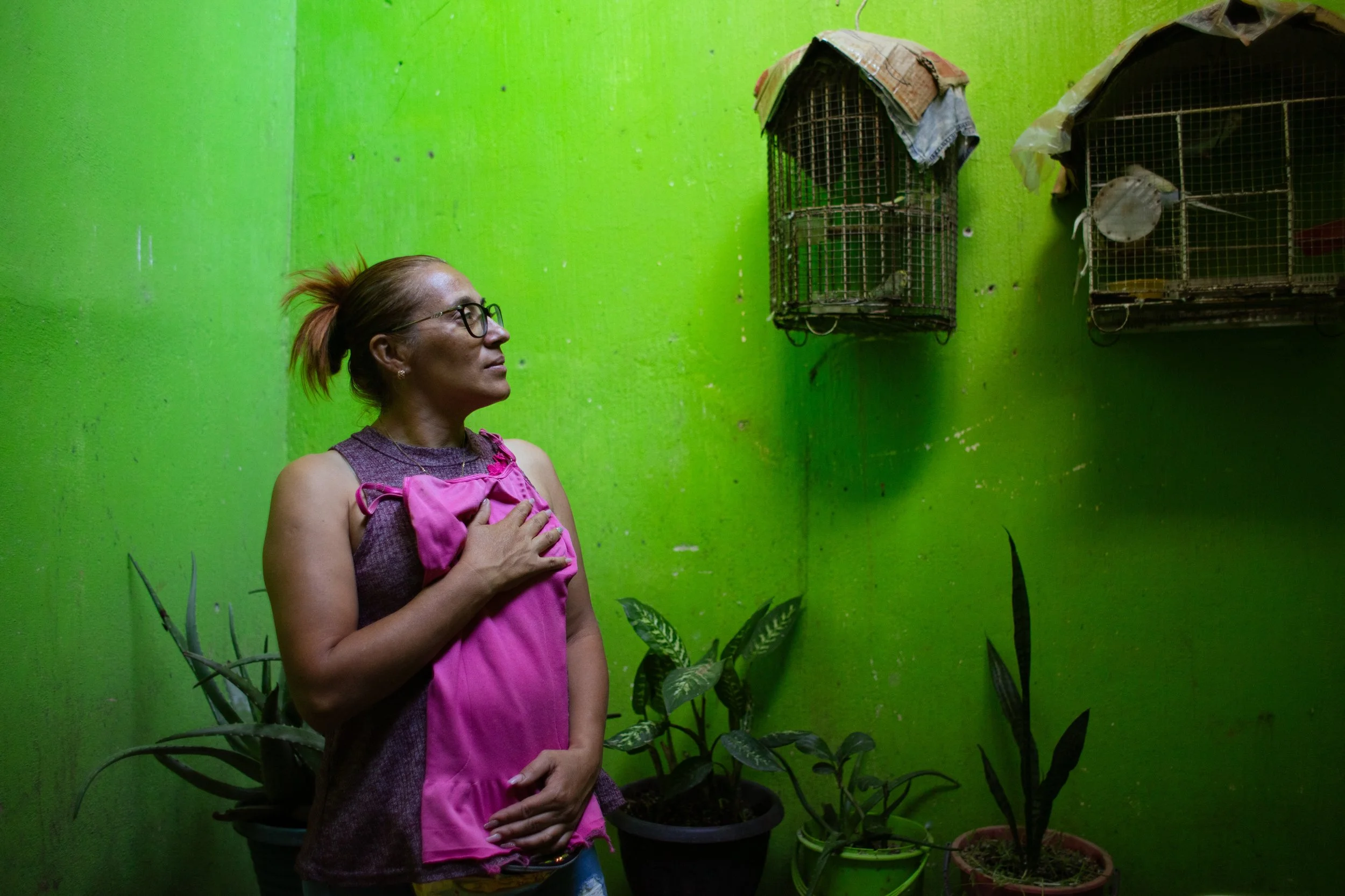 Dacia Ramírez, 42, mother of Achly Gabriela Méndez Ramírez who was killed during the fire at Hogar Seguro, held her daughter’s favorite dress in her home in Jutiapa, Guatemala on August 3, 2025. 