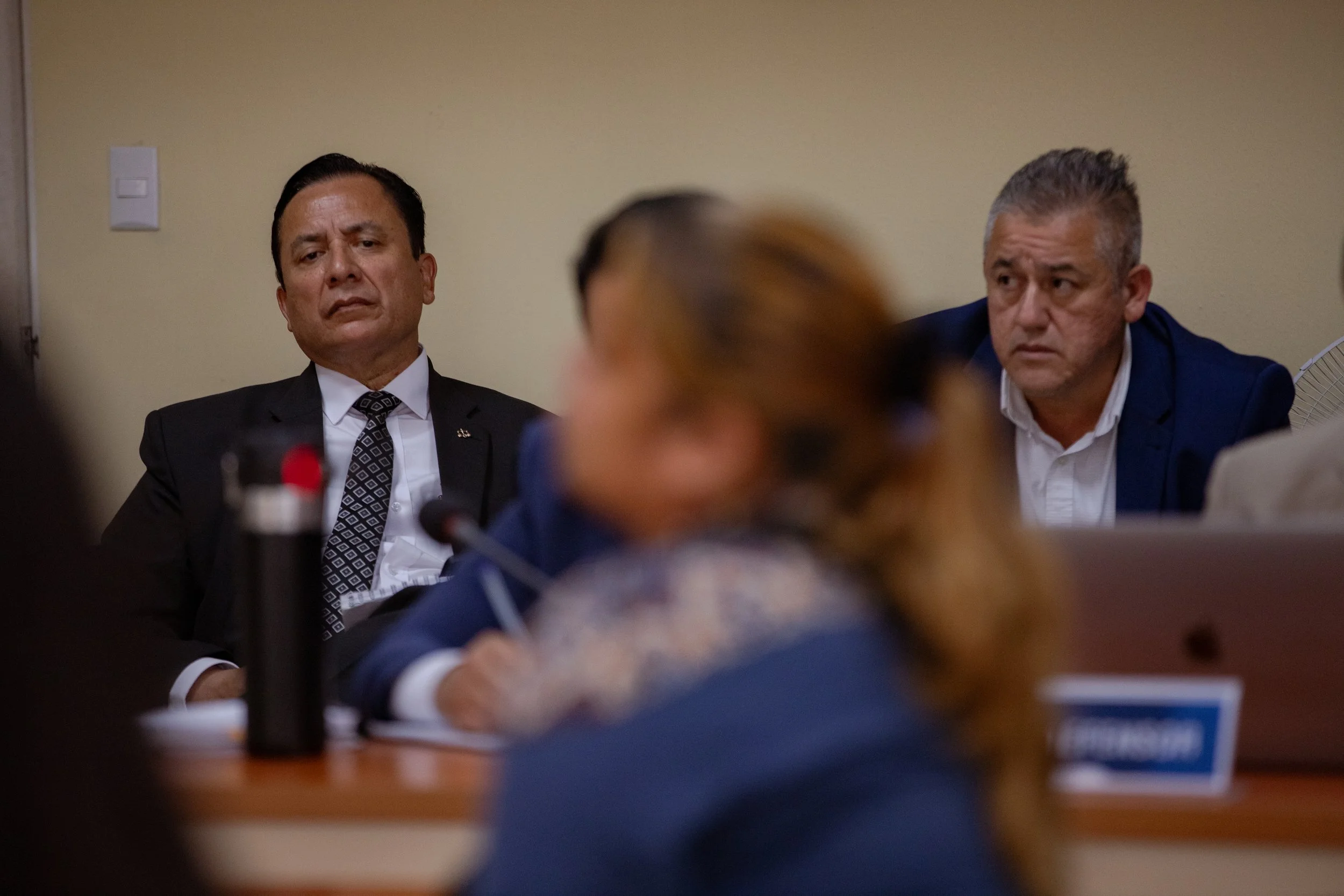 Luis Fernando Ruiz Ramirez, left, the lawyer for Luis Armando Perez Borja. Next to him is Carlos Rodas, the former Secretary of Social Welfare, as the two men listen to the final statement of a survivor.