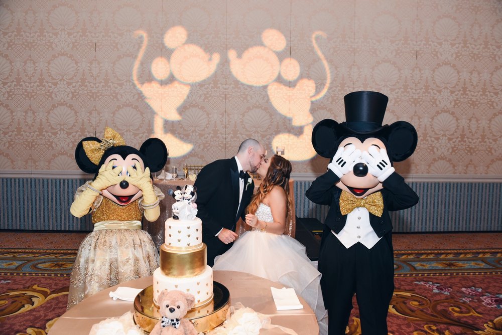 disney+wedding+risa+xu+mickey+minnie+cake+cutting+gold.jpeg