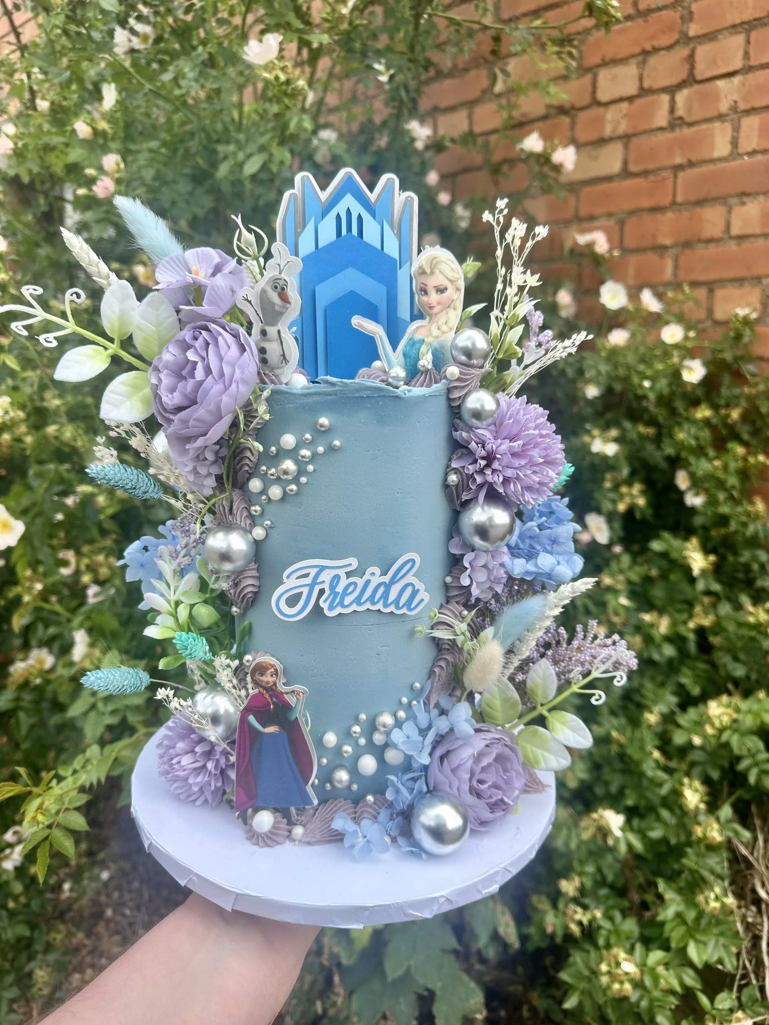 Frozen themed bespoke birthday cake with handmade decorations in Cheshire