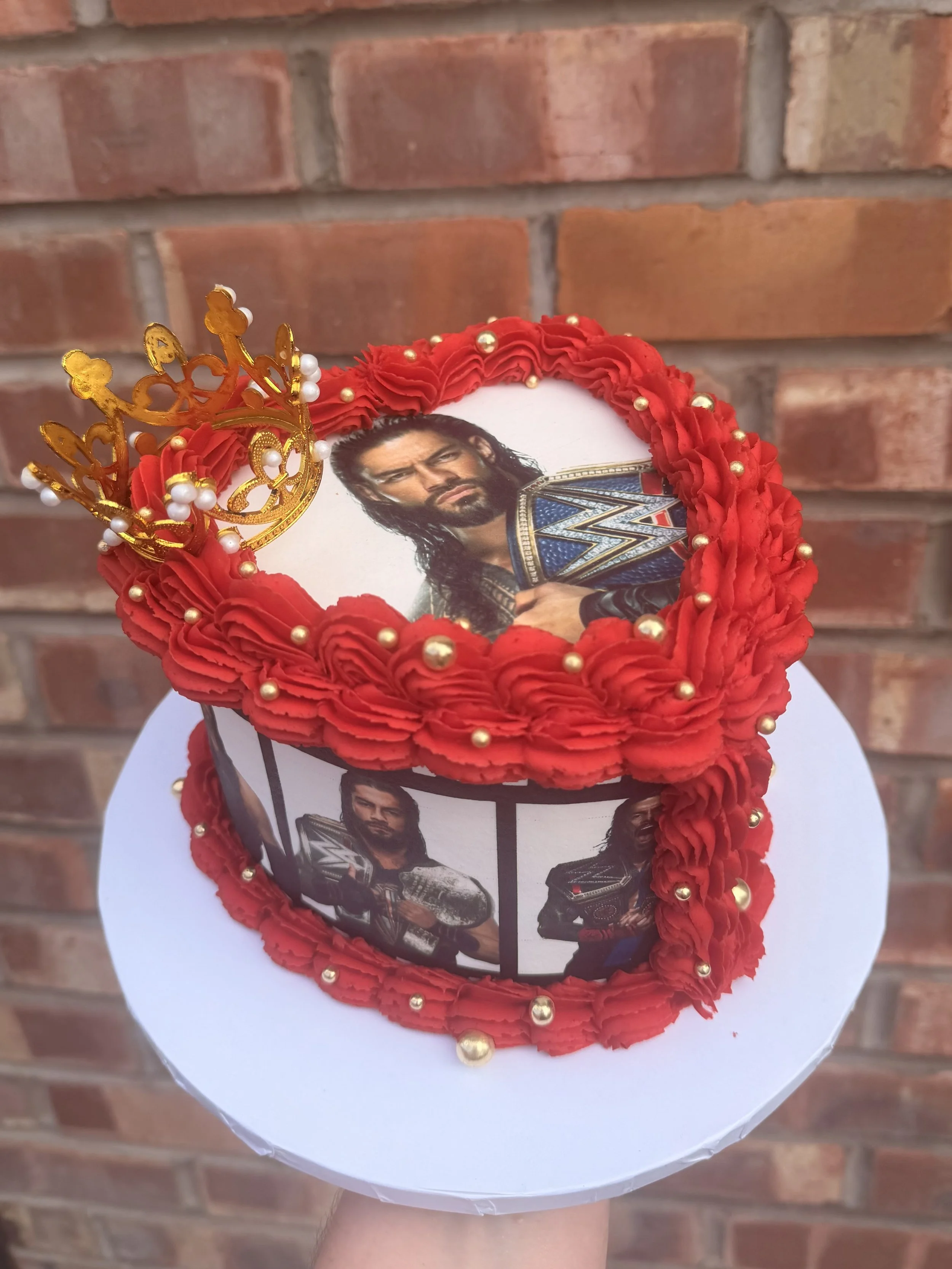 Red and Black Roman Reigns WWE themed birthday cake with personalised decorations