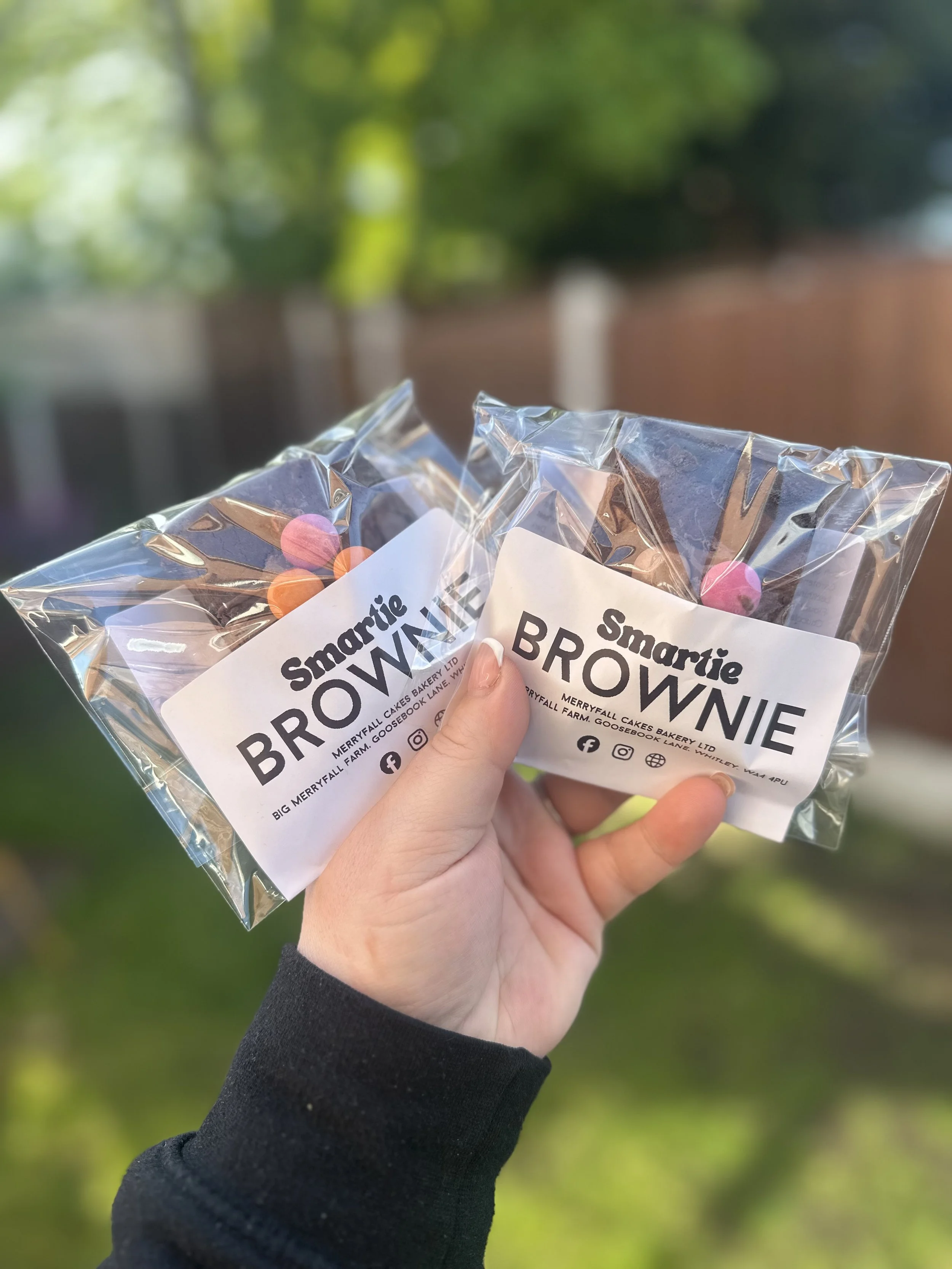 Individually packaged Smartie brownies prepared by Merryfall Cakes for wholesale customers