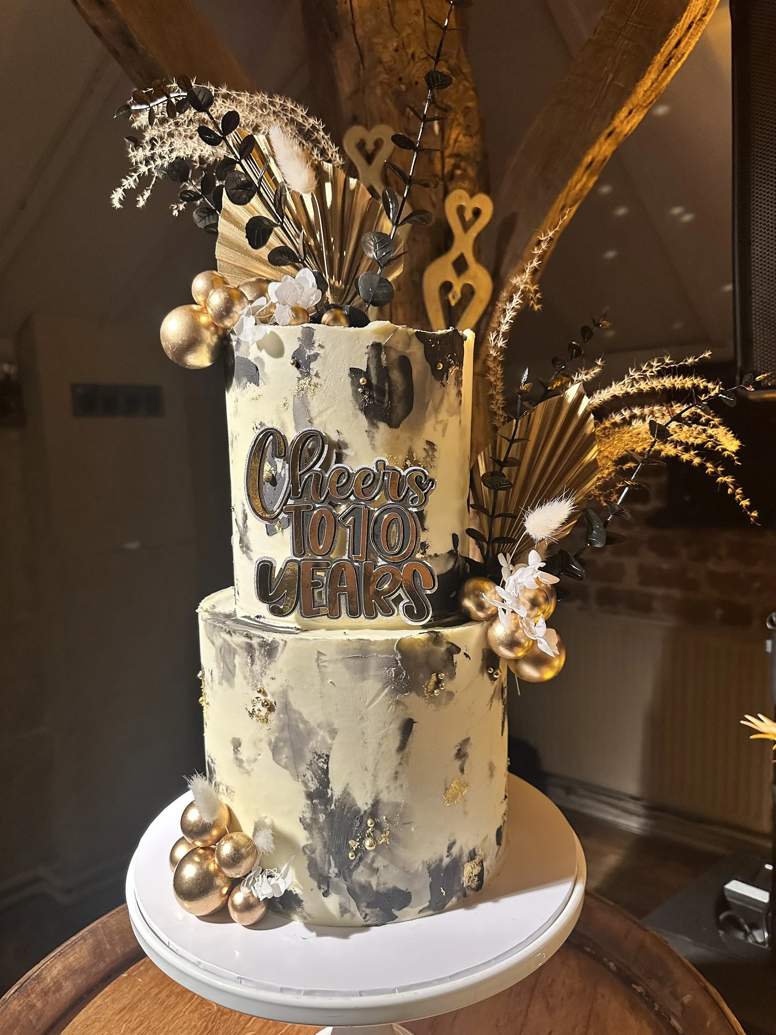Bespoke celebration cake delivered to a venue in Cheshire by Merryfall Cakes