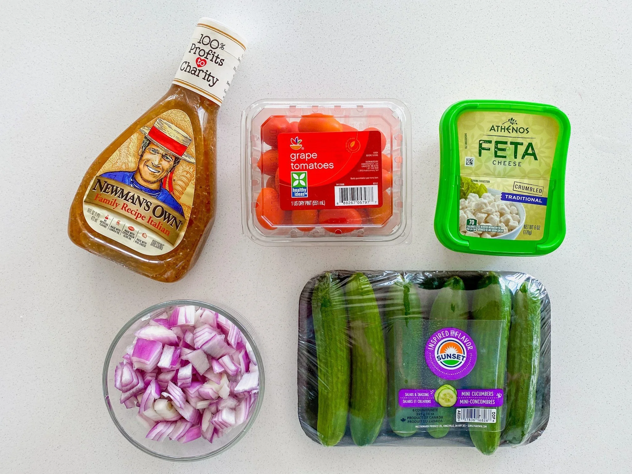 Make this easy Greek-inspired summer salad with cucumbers, tomatoes, feta cheese, and Greek dressing. A fresh 15-minute side dish perfect for BBQs, meal prep, and healthy lunches.