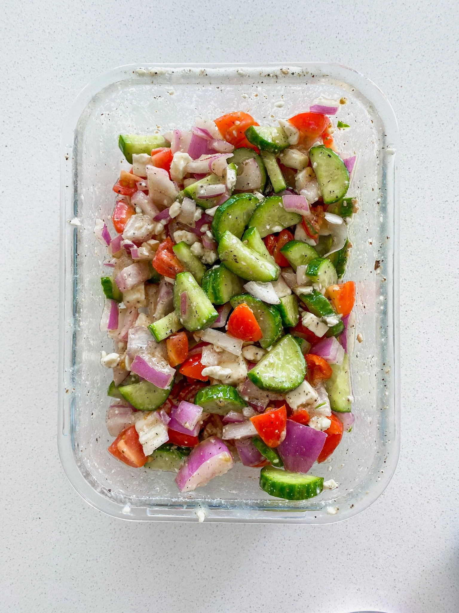 Make this easy Greek-inspired summer salad with cucumbers, tomatoes, feta cheese, and Greek dressing. A fresh 15-minute side dish perfect for BBQs, meal prep, and healthy lunches.