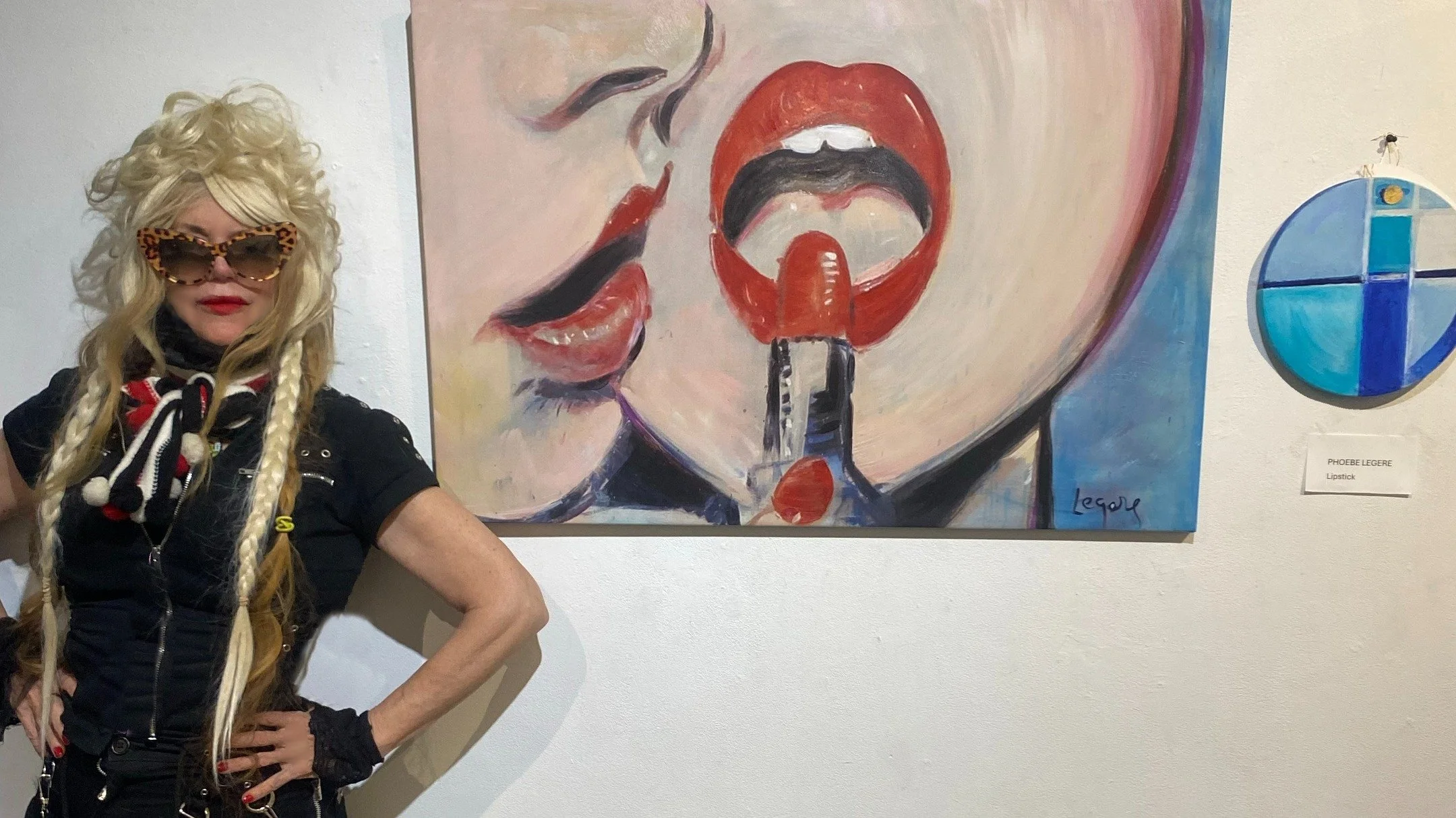 Standing next to my two paintings Lipstick 1 and Lipstick 2 - at Gallery 128 - 128 Rivington #NYC If I look like I just lost one of my best friends, I did - - heaven received a new angel last night. Director Rosa Von Praunheim passed in his sleep. I 