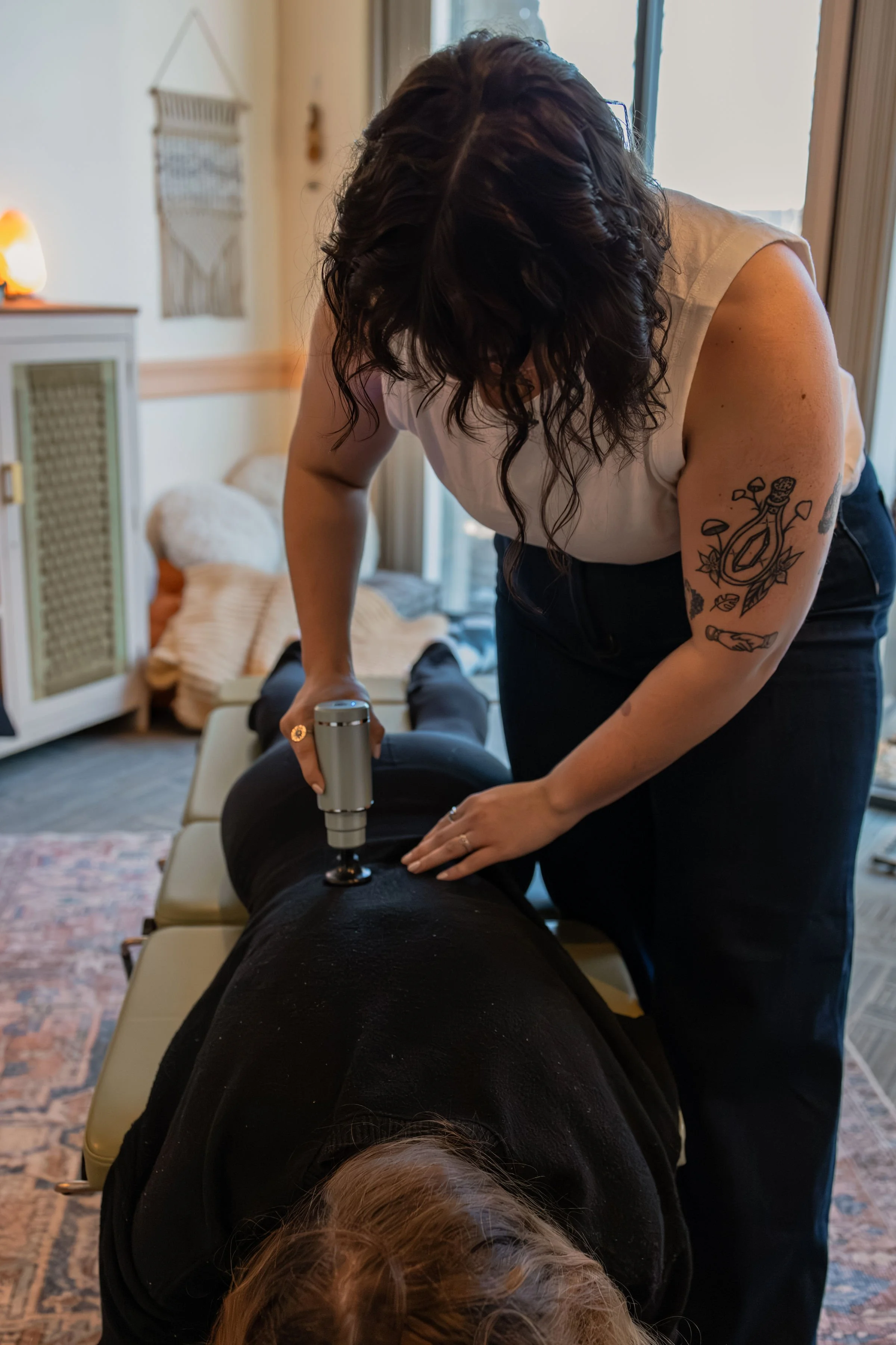 Dr.Andi using massage tool