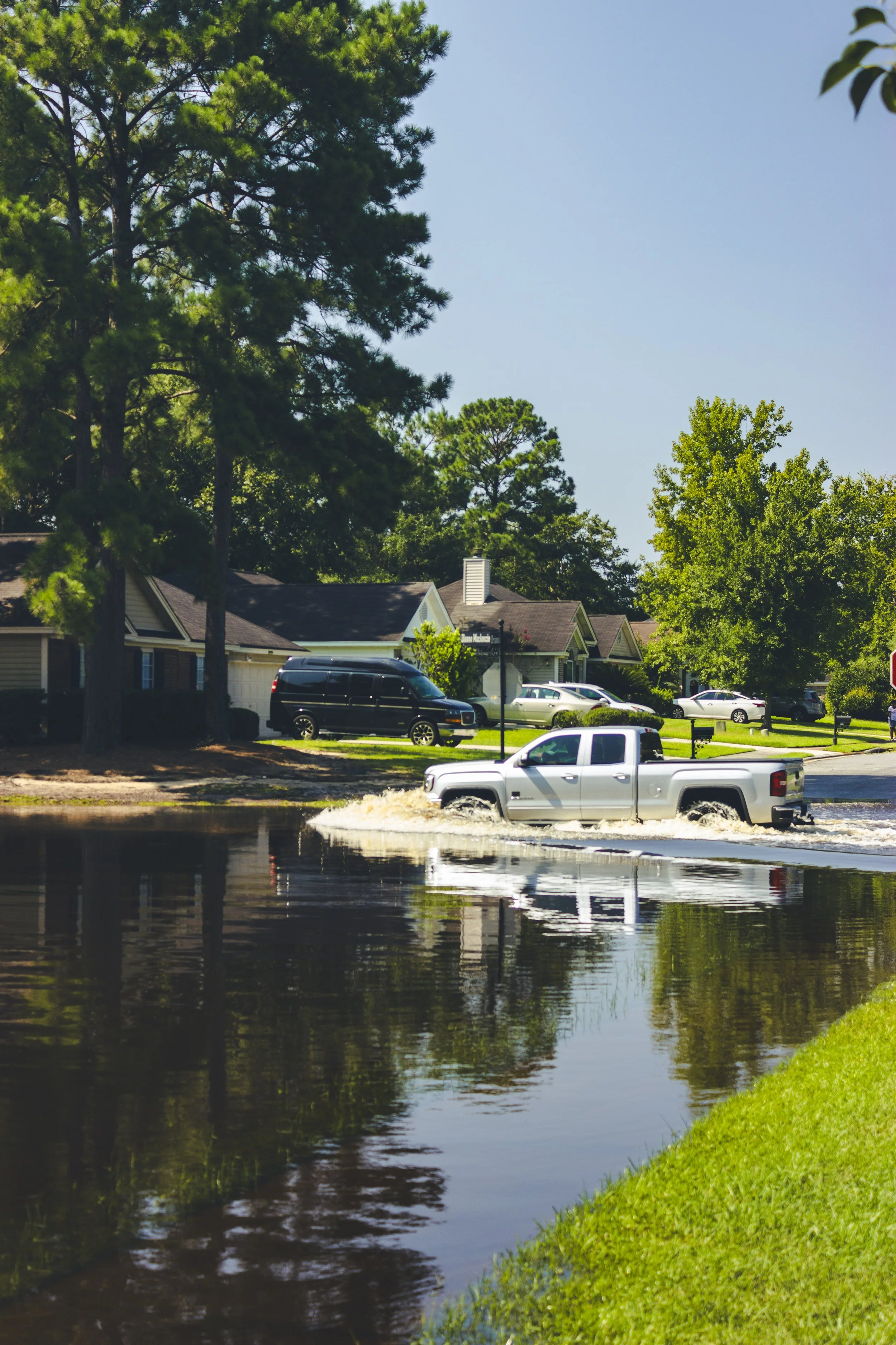 A truck driving through the water