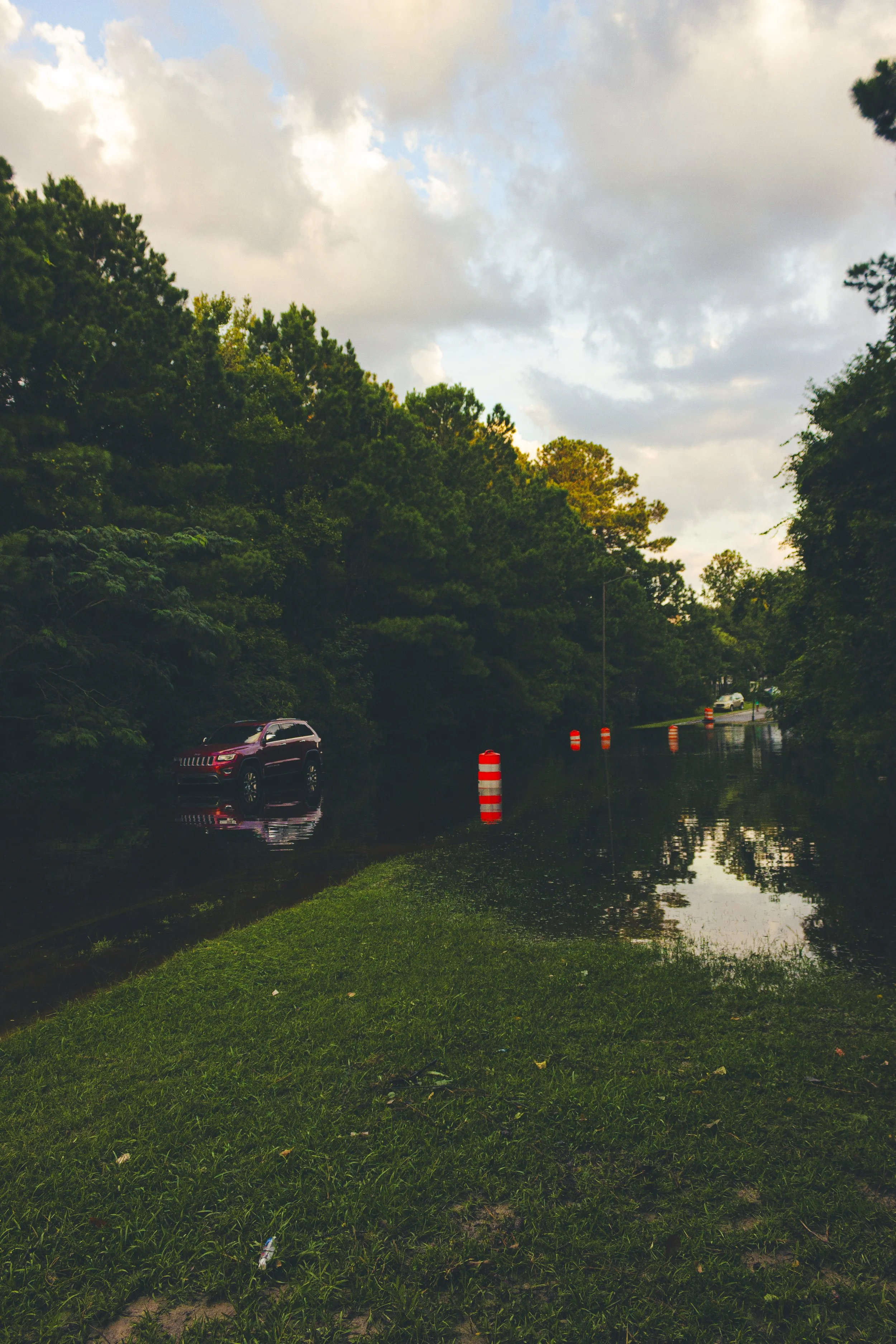 Standing water on Bradley Boulevard at sunset