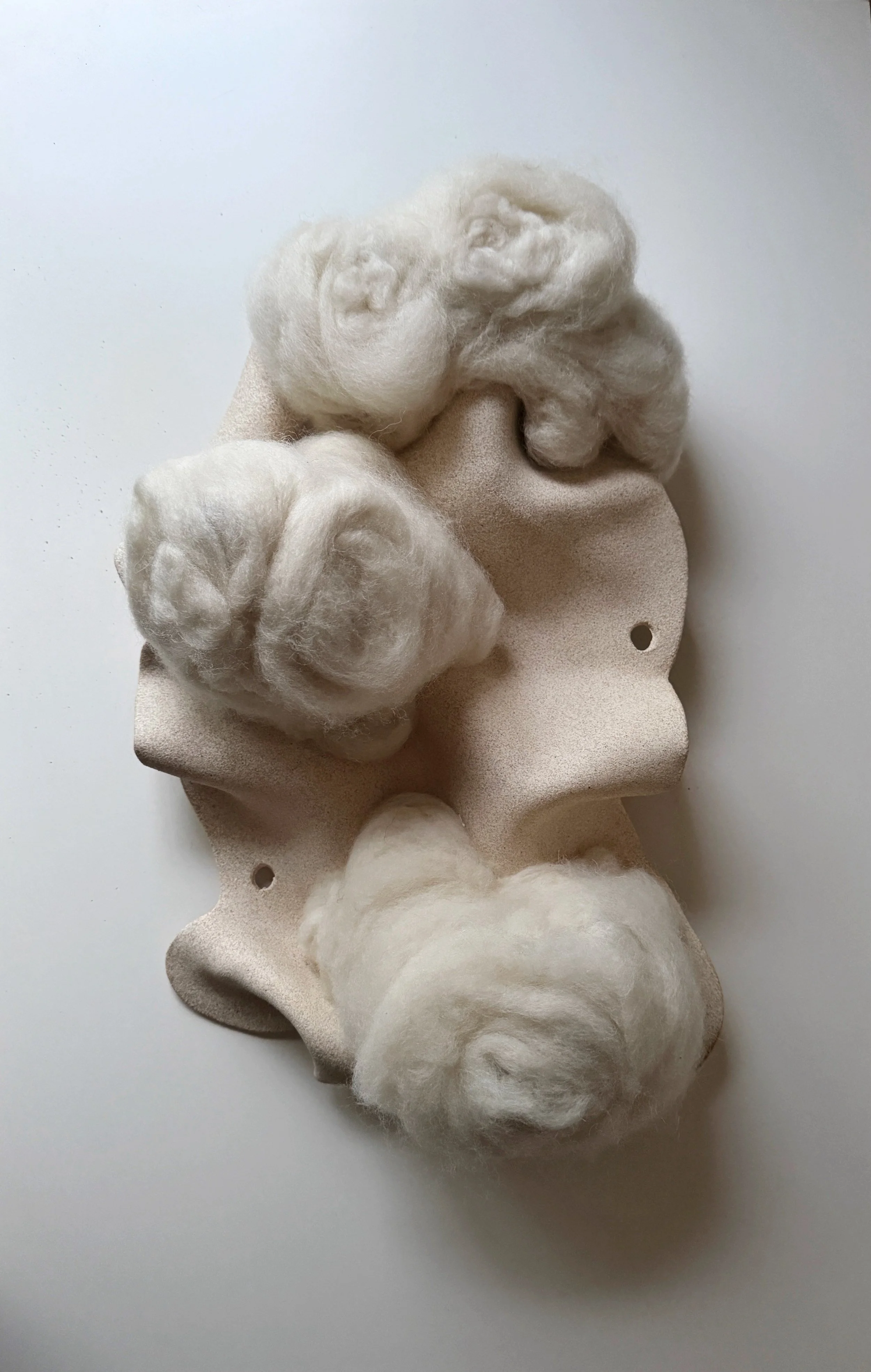 ceramic wall art piece combining white stoneware clay and white wool fiber