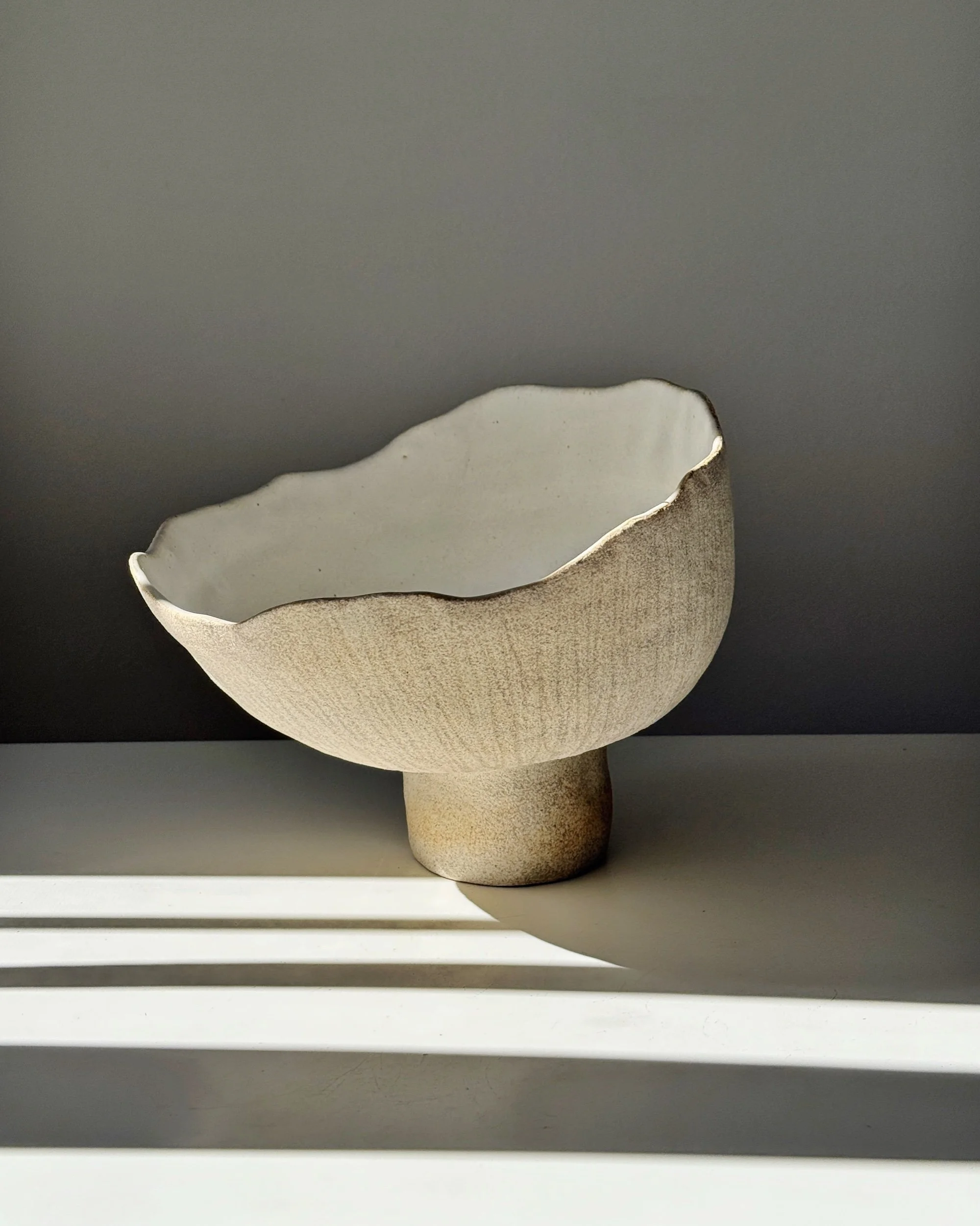 white sculptural ceramic vase