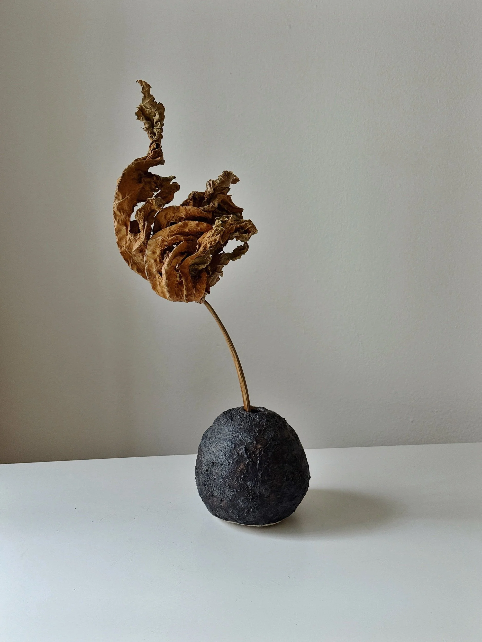 black textured ceramic bud vase