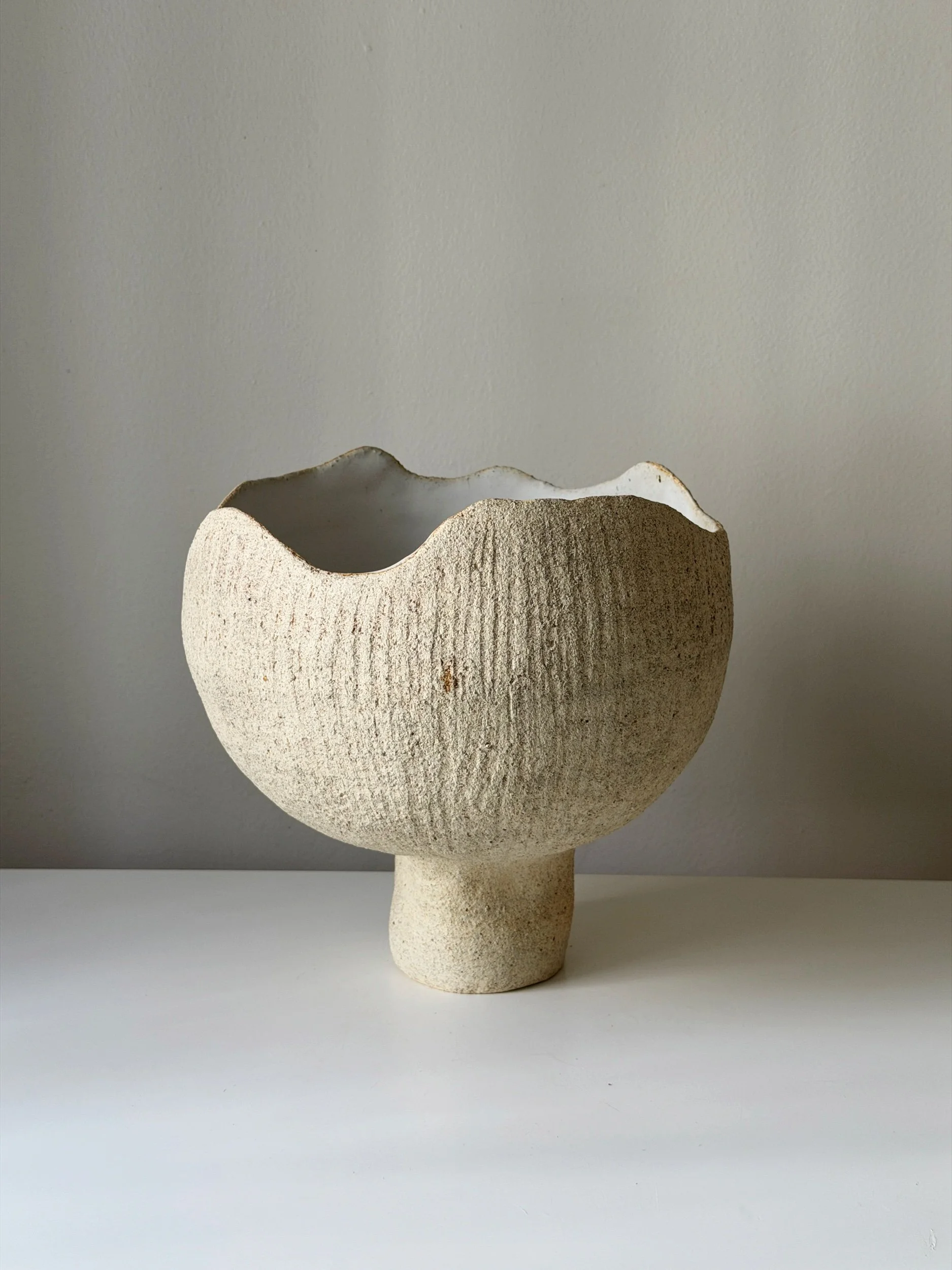 large pottery vase in white textured clay, organically shaped