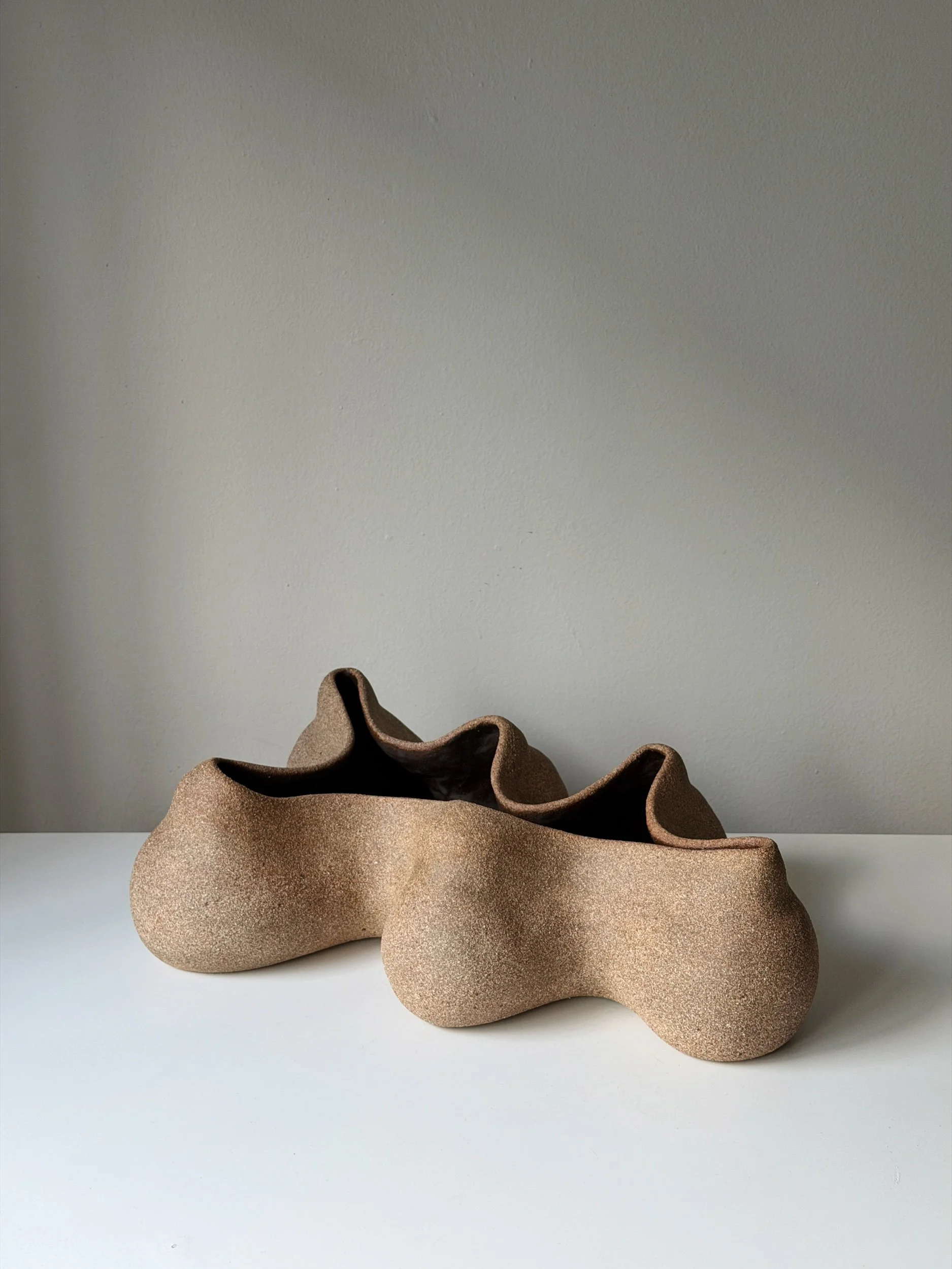 A hand-built ceramic sculpture that doubles as a vessel