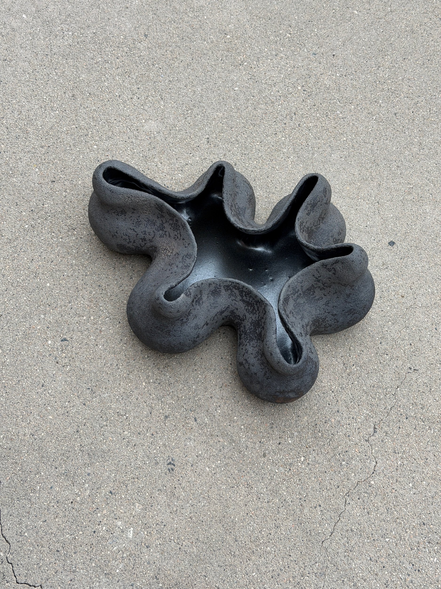 sculptural ceramic vase in black textured finish, hand sculpted