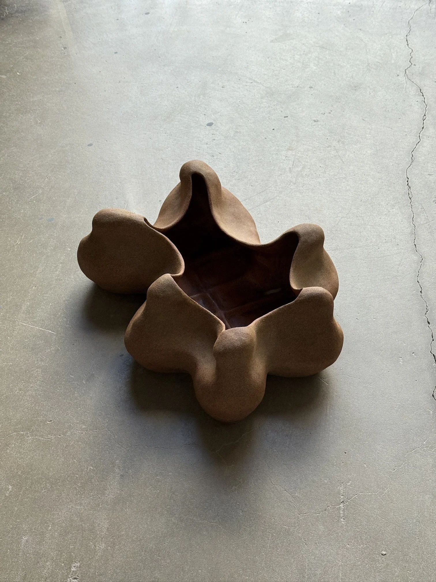 Anna Shipulina shaping a coiled stoneware commission in her Los Angeles studio