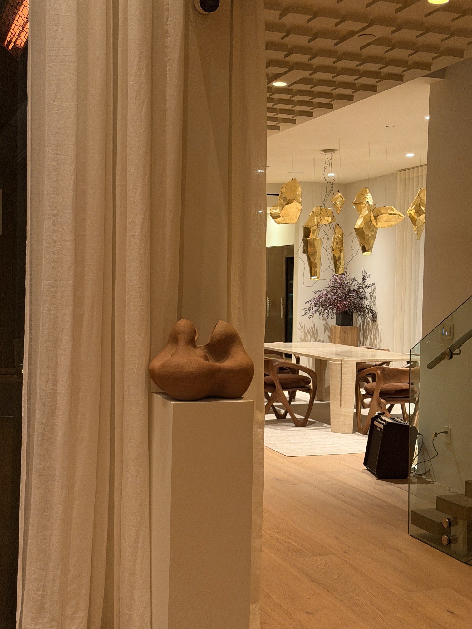 Sculptural ceramic vessel by Anna Shipulina displayed on a pedestal in a luxury interior space, Los Angeles