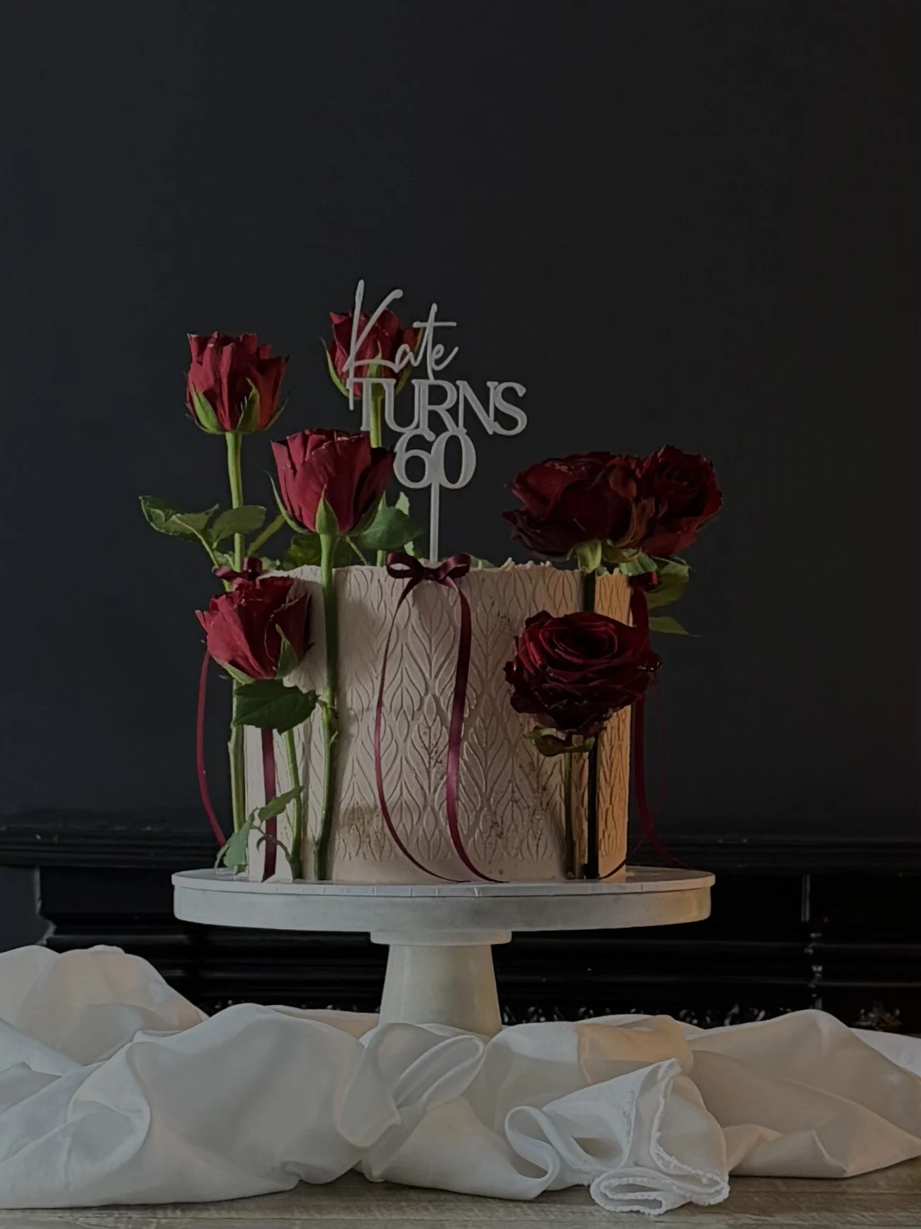 60th birthday cake with red roses and a personalised topper. Cakes in Altrincham. Luxury cakes in Cheshire and Manchester.