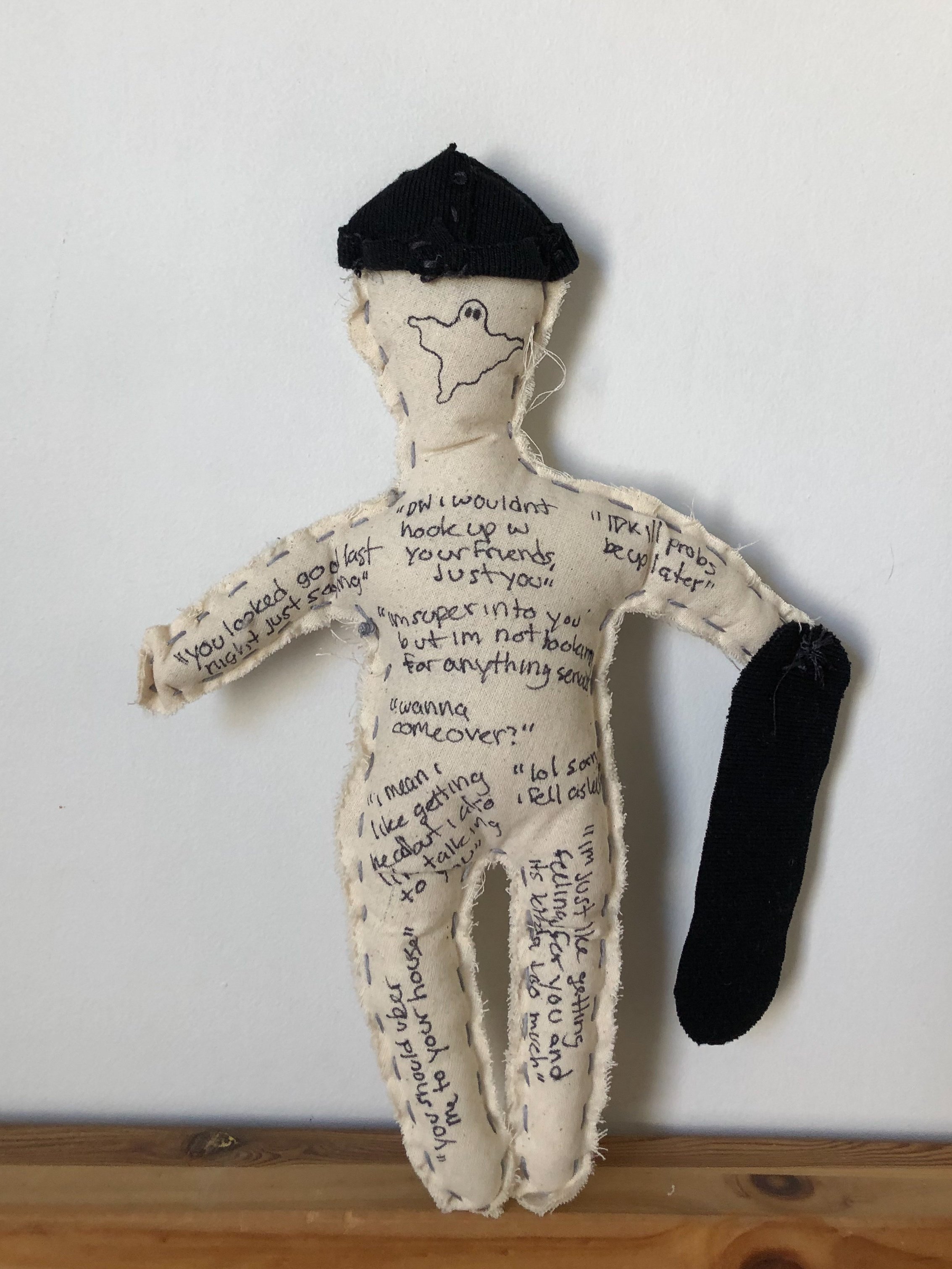 voodoo doll - cotton cloth, embroidery thread, and ink (commentary on the vancouver dating scene with actual text messages from "skater boys")