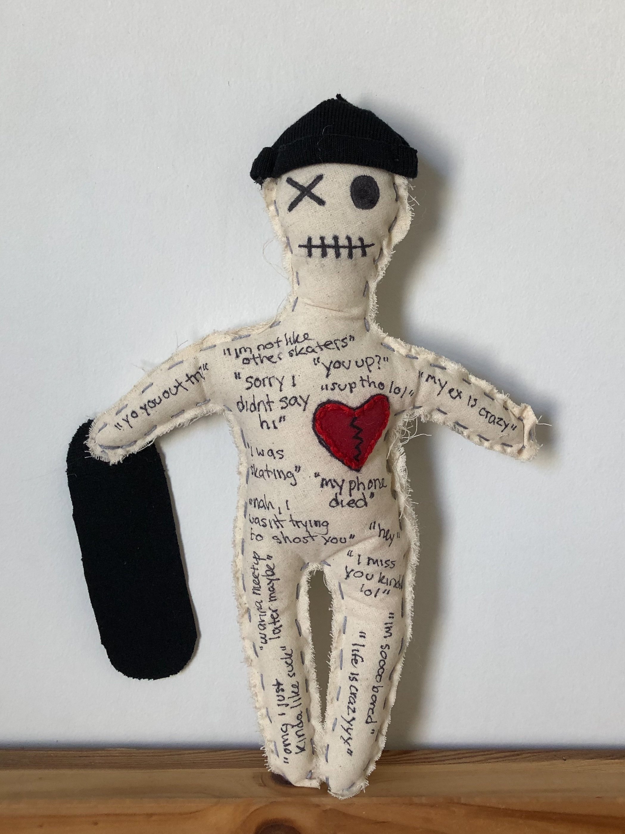 voodoo doll - cotton cloth, embroidery thread, and ink (commentary on the vancouver dating scene with actual text messages from "skater boys")