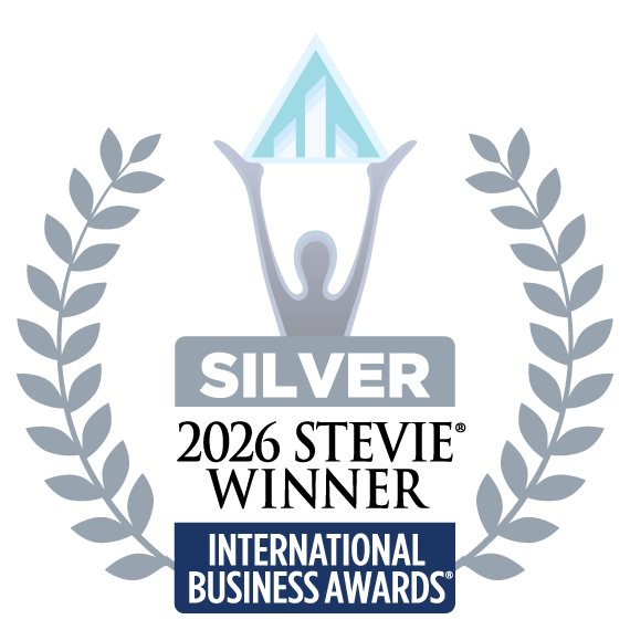 A silver award medal for the International Business Awards featuring a figure holding a crystal trophy above with laurel branches on each side.