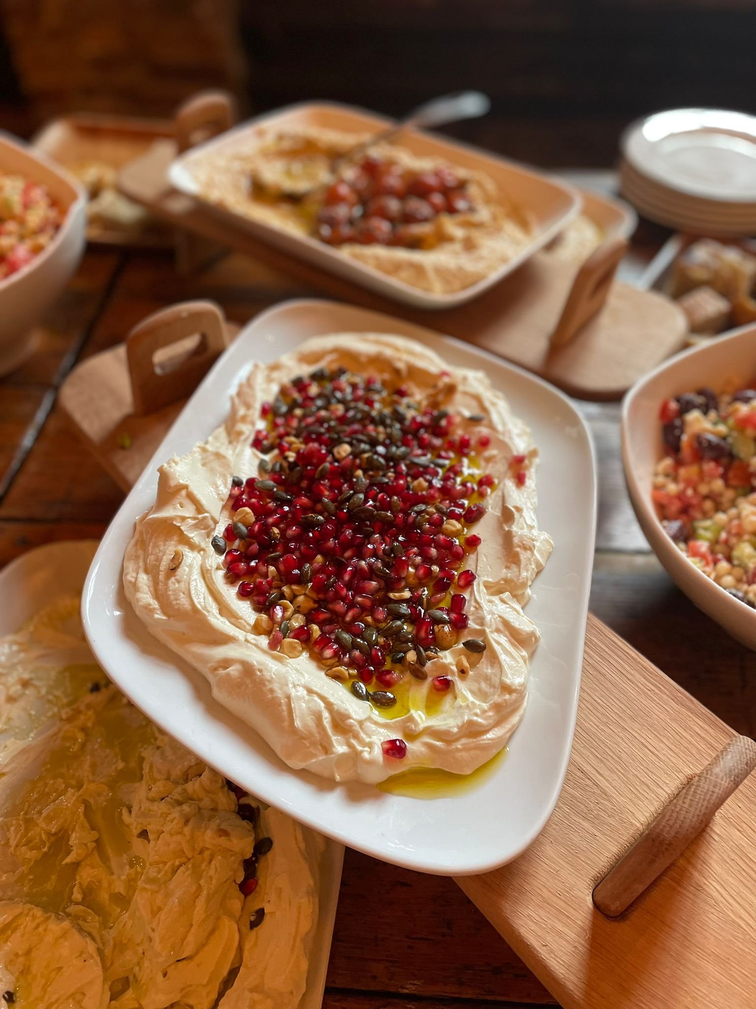 Creamy Hummus topped with pomegranate and sunflower seeds
