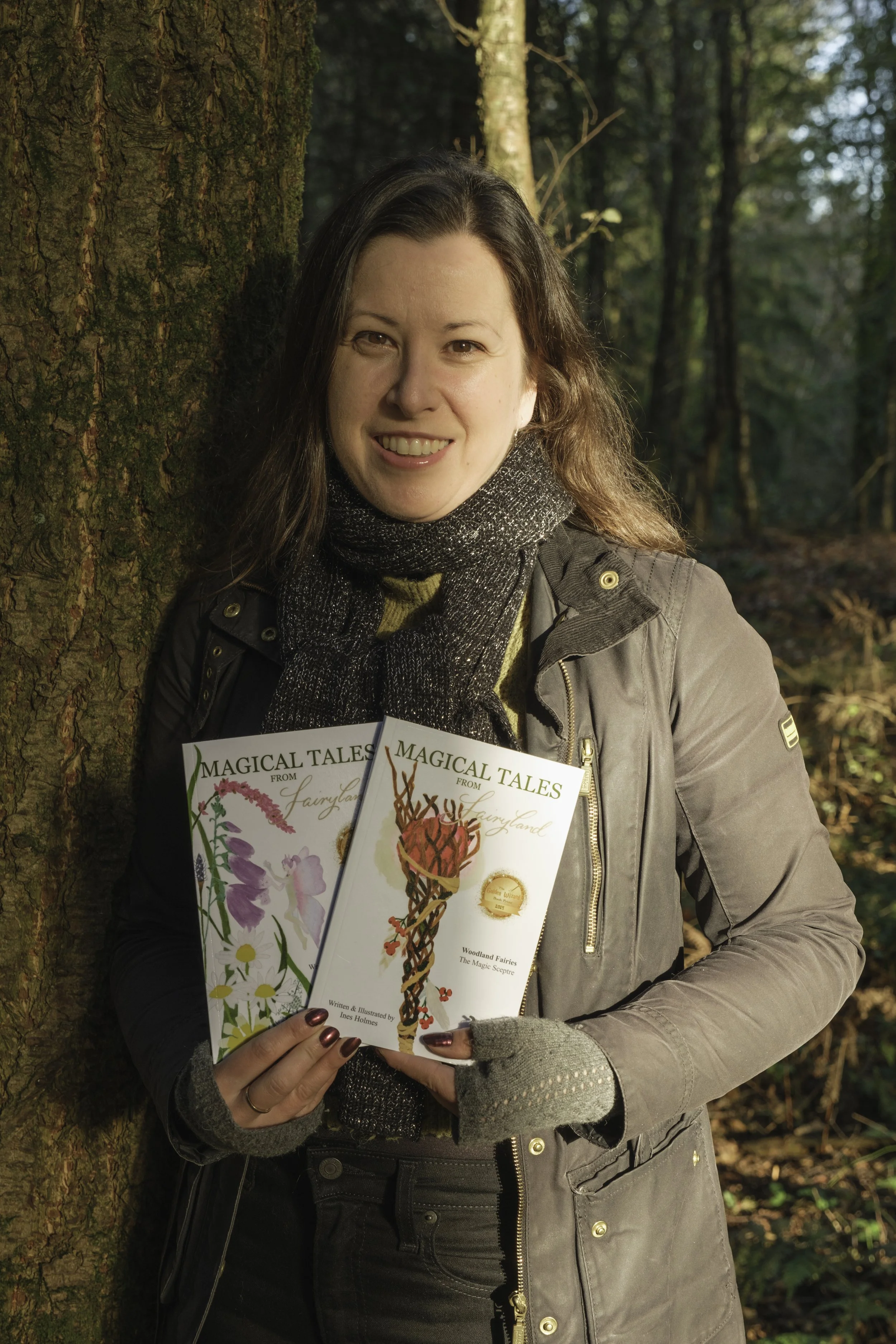 Ines Holmes, children's book writer and artist in a woodland in the border between Somerset and Wiltshire, UK