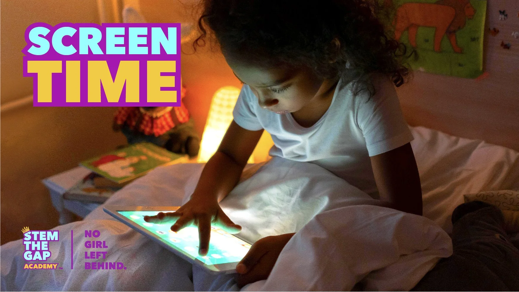 Young girl using a tablet, representing children’s screen time and digital learning.