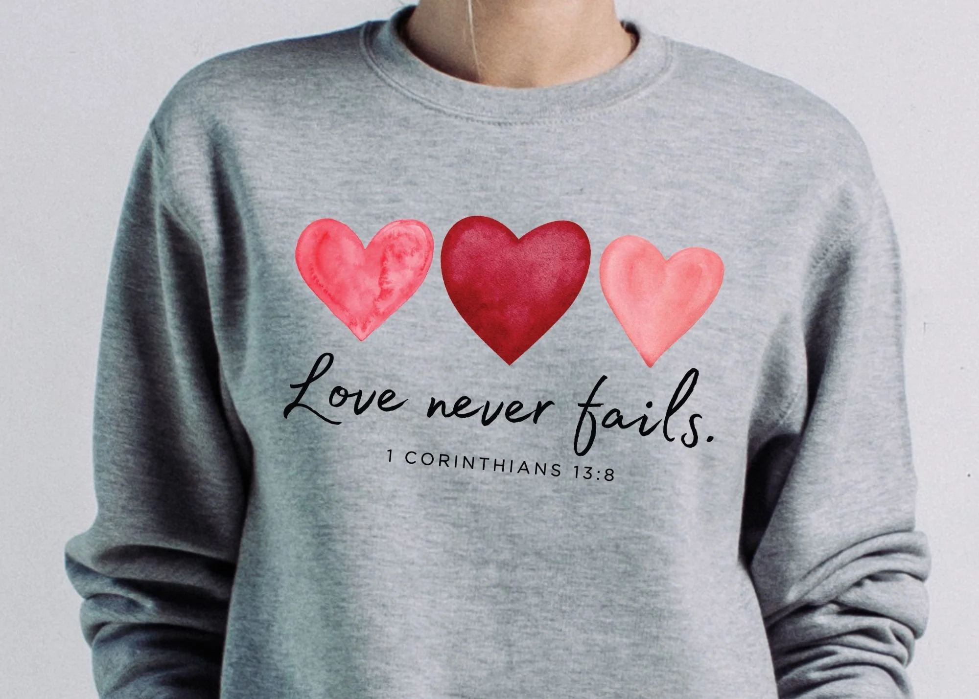“Love Never Fails” Sweatshirt