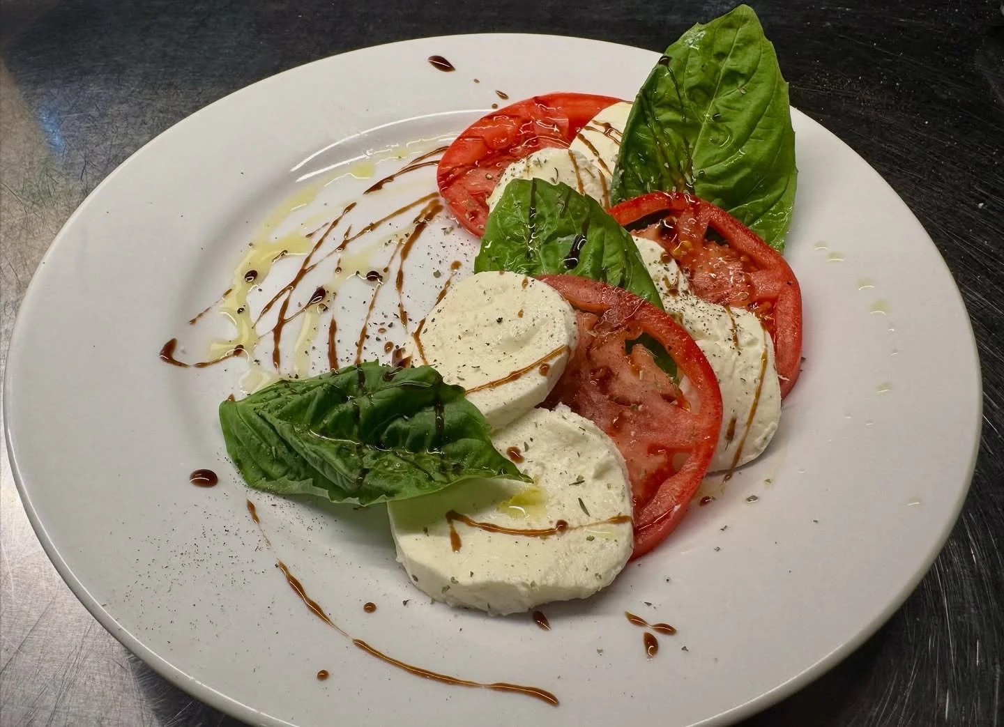 Is there really anything better than a true caprese salad? Fresh mozzarella from brine, freshly sliced tomatoes, fresh basil, a touch of salt, quality olive oil, and a balsamic drizzle. So clean and delicious that it almost didn&rsquo;t need a captio