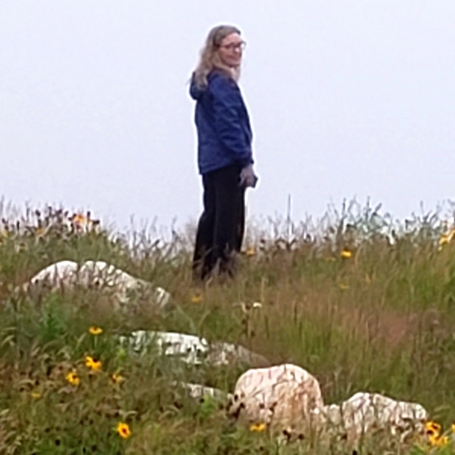Patrice Lefebvre, life coach, on a Nova Scotia coastal trail — a welcoming gesture to walk this path together.