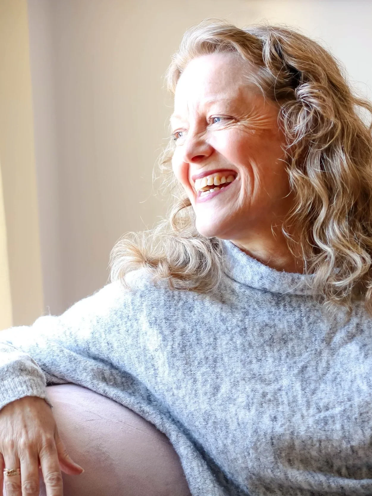 Patrice Lefebvre, life coach for highly sensitive people, looking out a window thoughtfully.