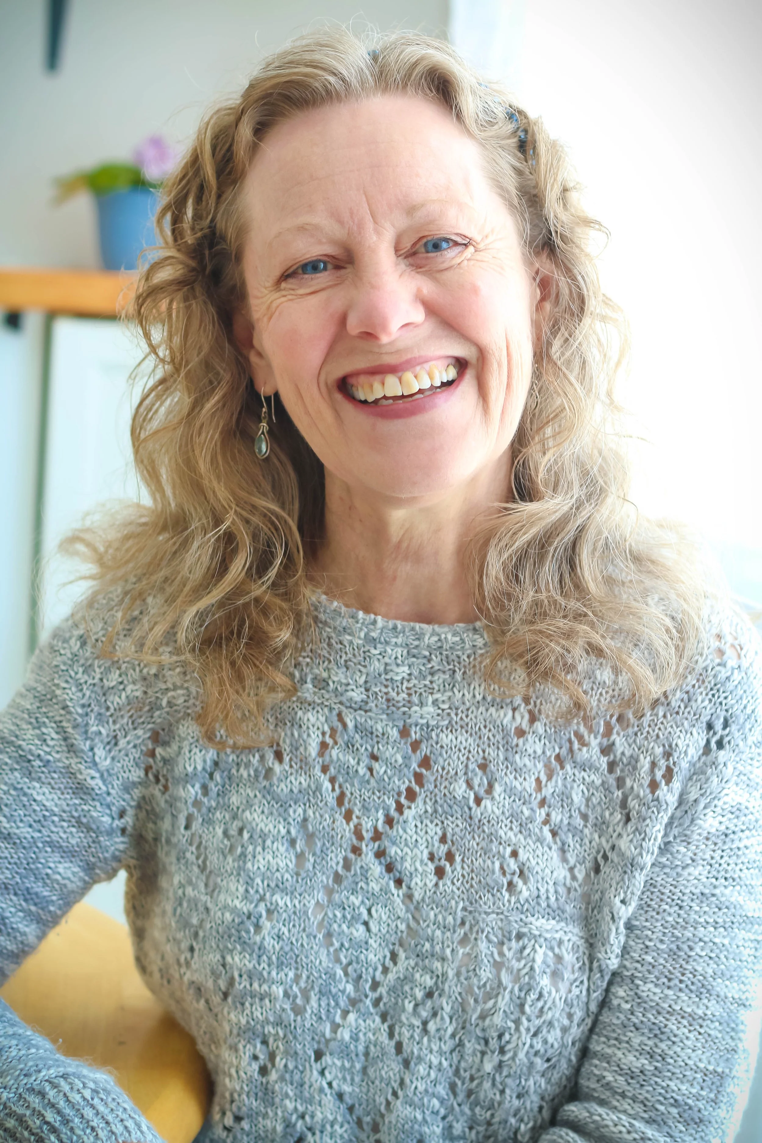 Patrice Lefebvre, Ottawa life coach for highly sensitive people, smiling warmly indoors.